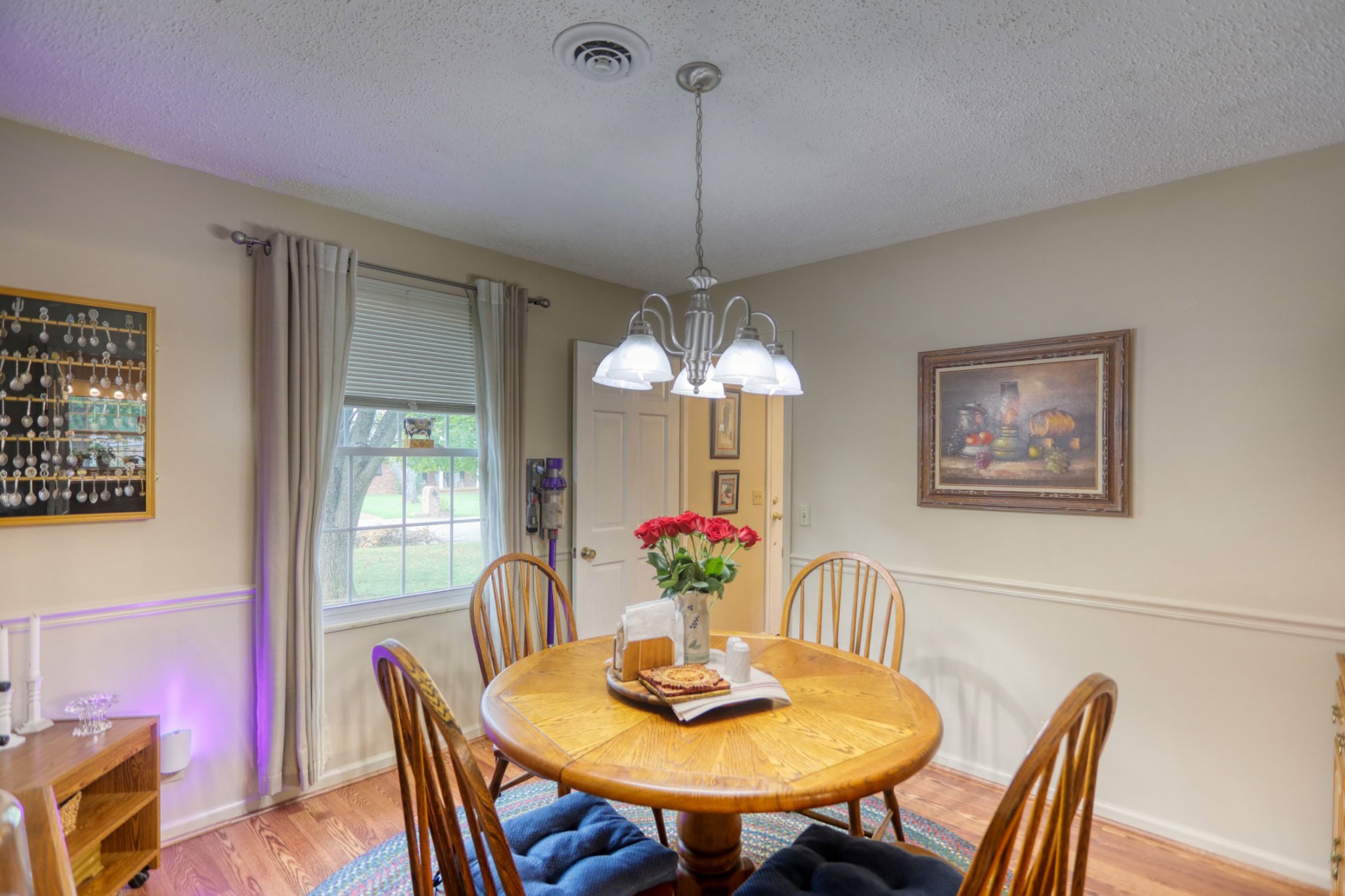 3517 Colony Point West Nashville, TN 37217 - Photo 8 of 34 a dining room with furniture a potted plant and a chandelier