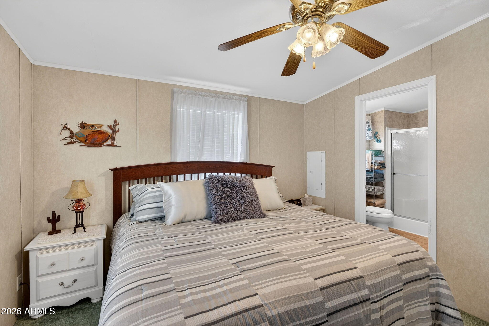 747 East Germann Road, Unit 54 San Tan Valley, AZ 85140 - Photo 11 of 26 a bedroom with a large bed and a chandelier