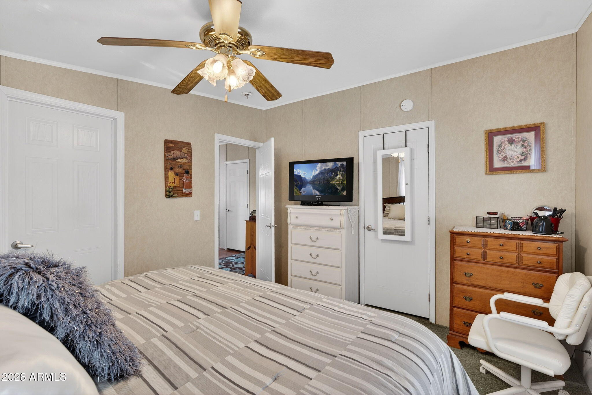 747 East Germann Road, Unit 54 San Tan Valley, AZ 85140 - Photo 12 of 26 a bedroom with a bed and a flat screen tv