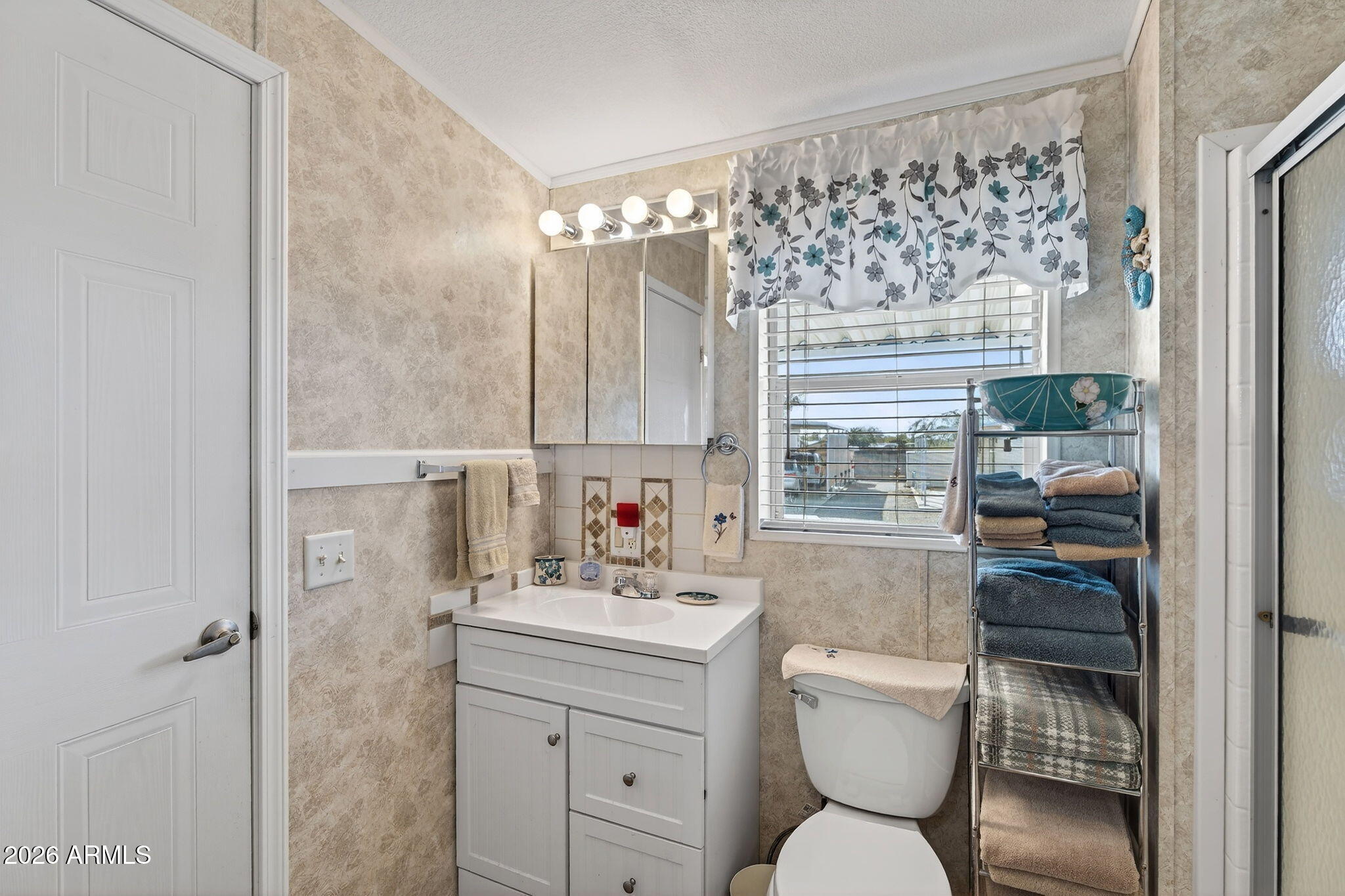 747 East Germann Road, Unit 54 San Tan Valley, AZ 85140 - Photo 13 of 26 a bathroom with a sink toilet vanity and tub