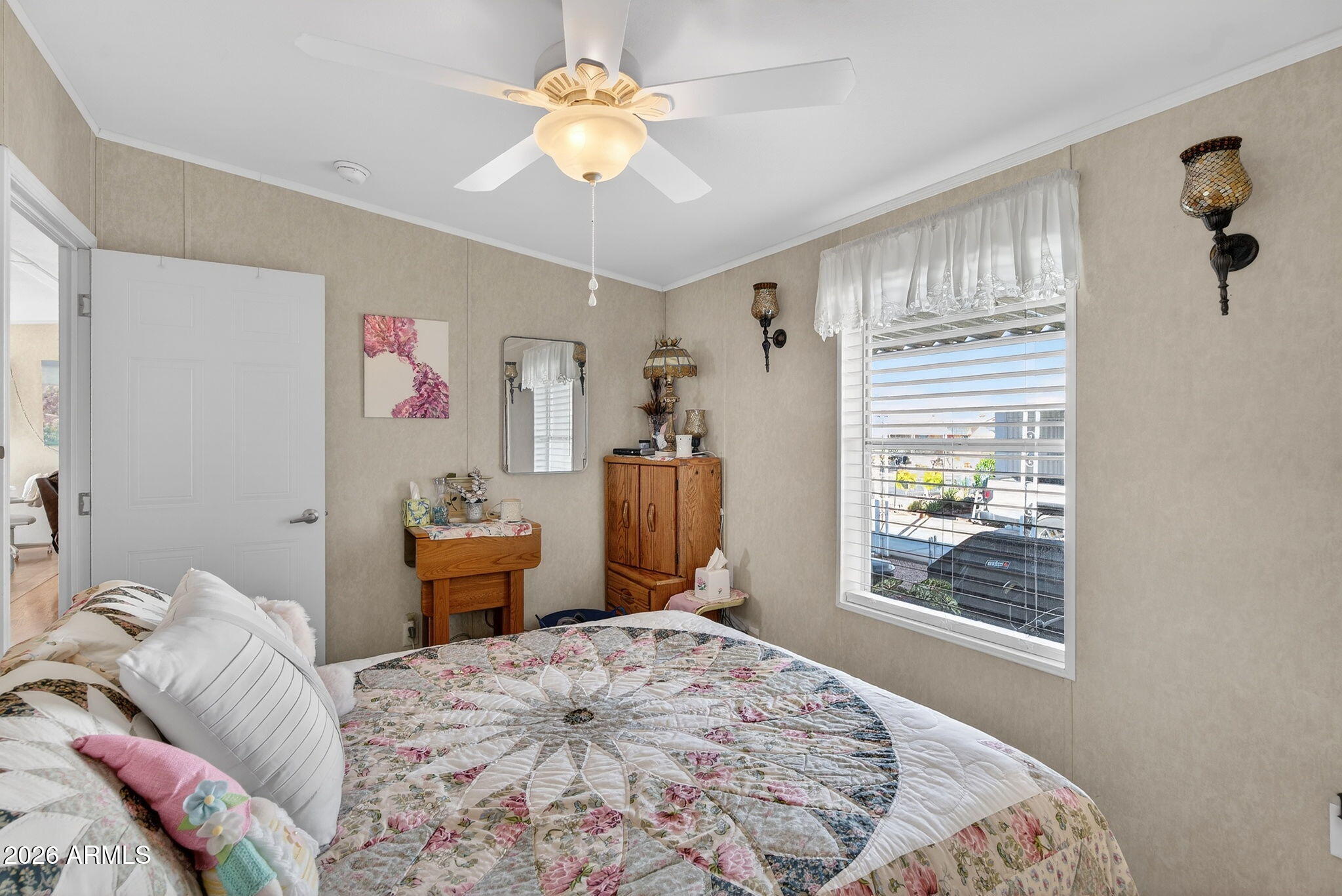 747 East Germann Road, Unit 54 San Tan Valley, AZ 85140 - Photo 15 of 26 a bedroom with a bed dresser and a window