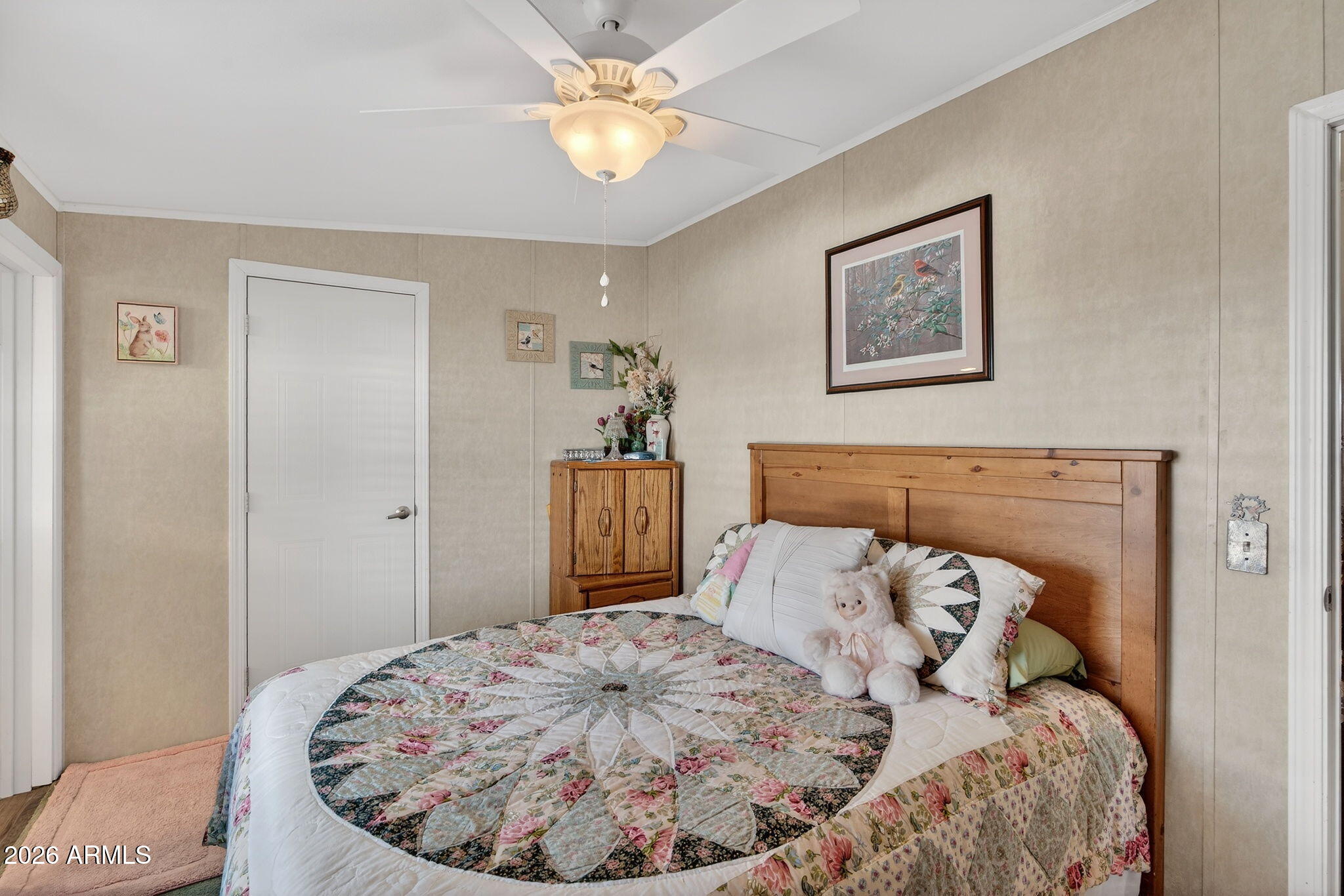 747 East Germann Road, Unit 54 San Tan Valley, AZ 85140 - Photo 16 of 26 a bed sitting in a bedroom and a chandelier