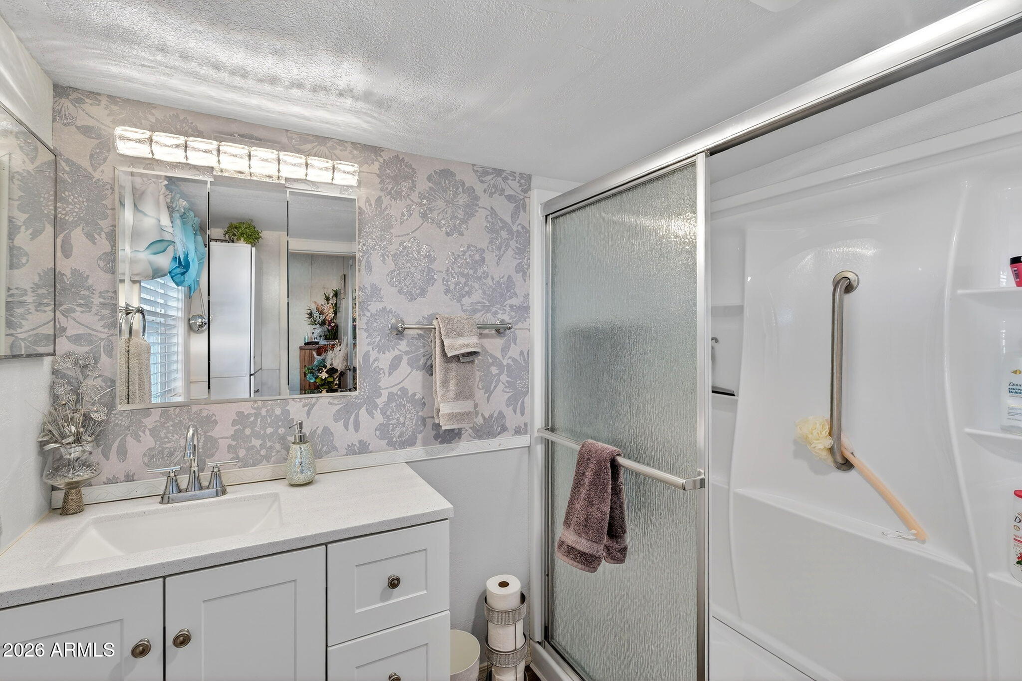 747 East Germann Road, Unit 54 San Tan Valley, AZ 85140 - Photo 18 of 26 a bathroom with a sink and mirror with shower