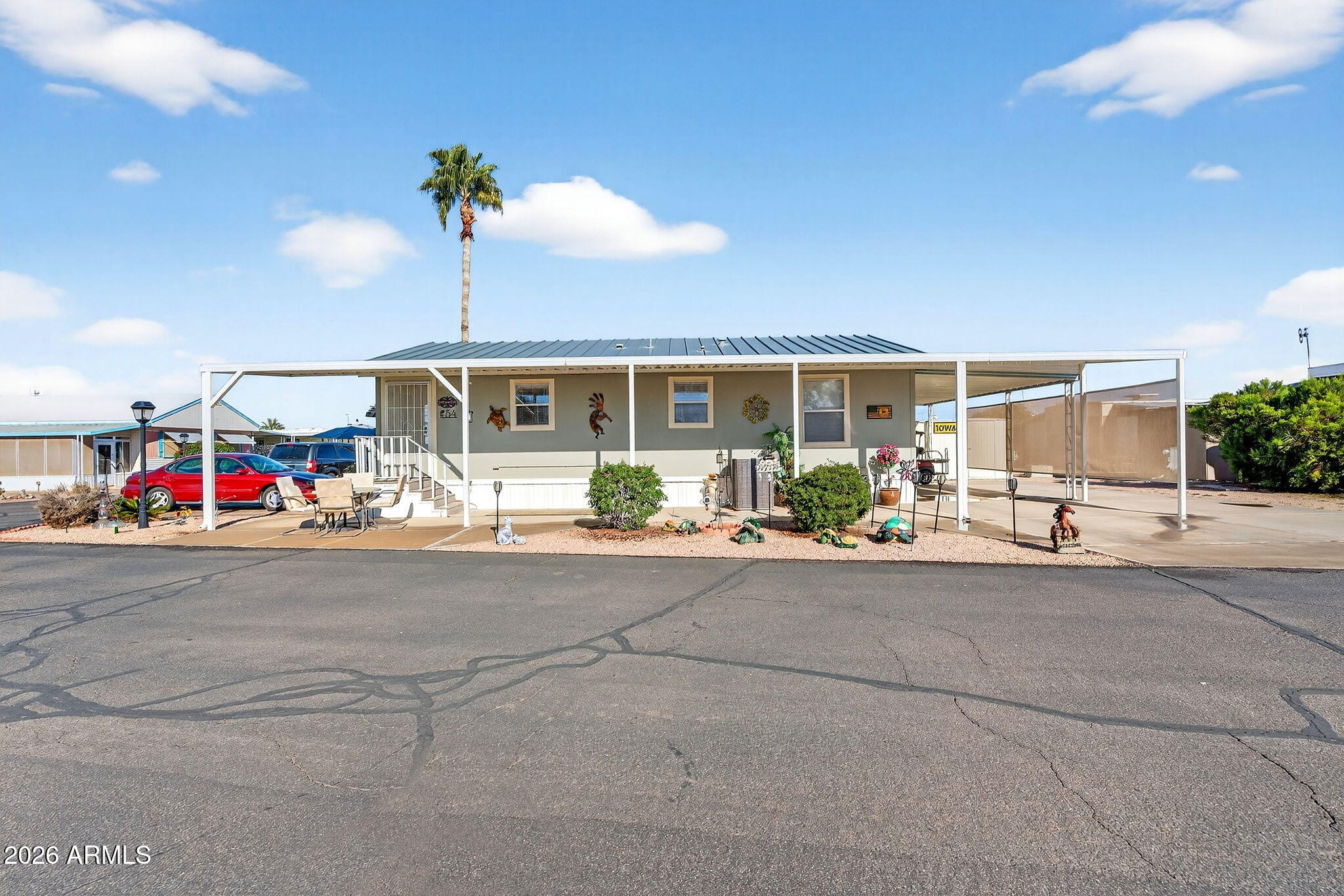 747 East Germann Road, Unit 54 San Tan Valley, AZ 85140 - Photo 22 of 26 a view of a house with a patio and a garden