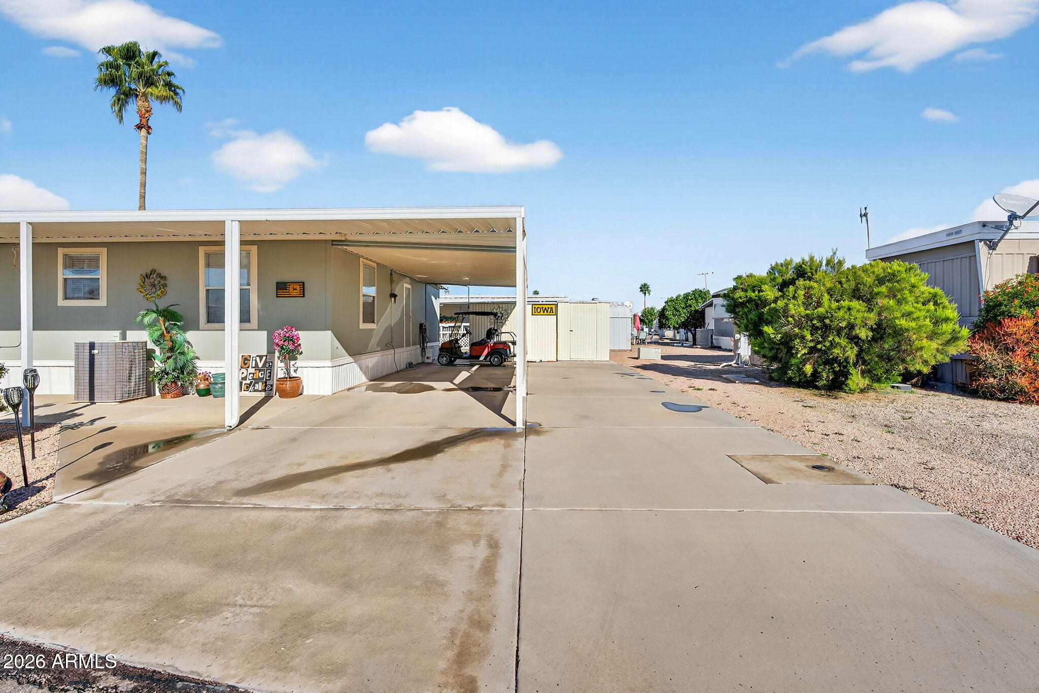 747 East Germann Road, Unit 54 San Tan Valley, AZ 85140 - Photo 25 of 26 a view of a livingroom with furniture and potted plants