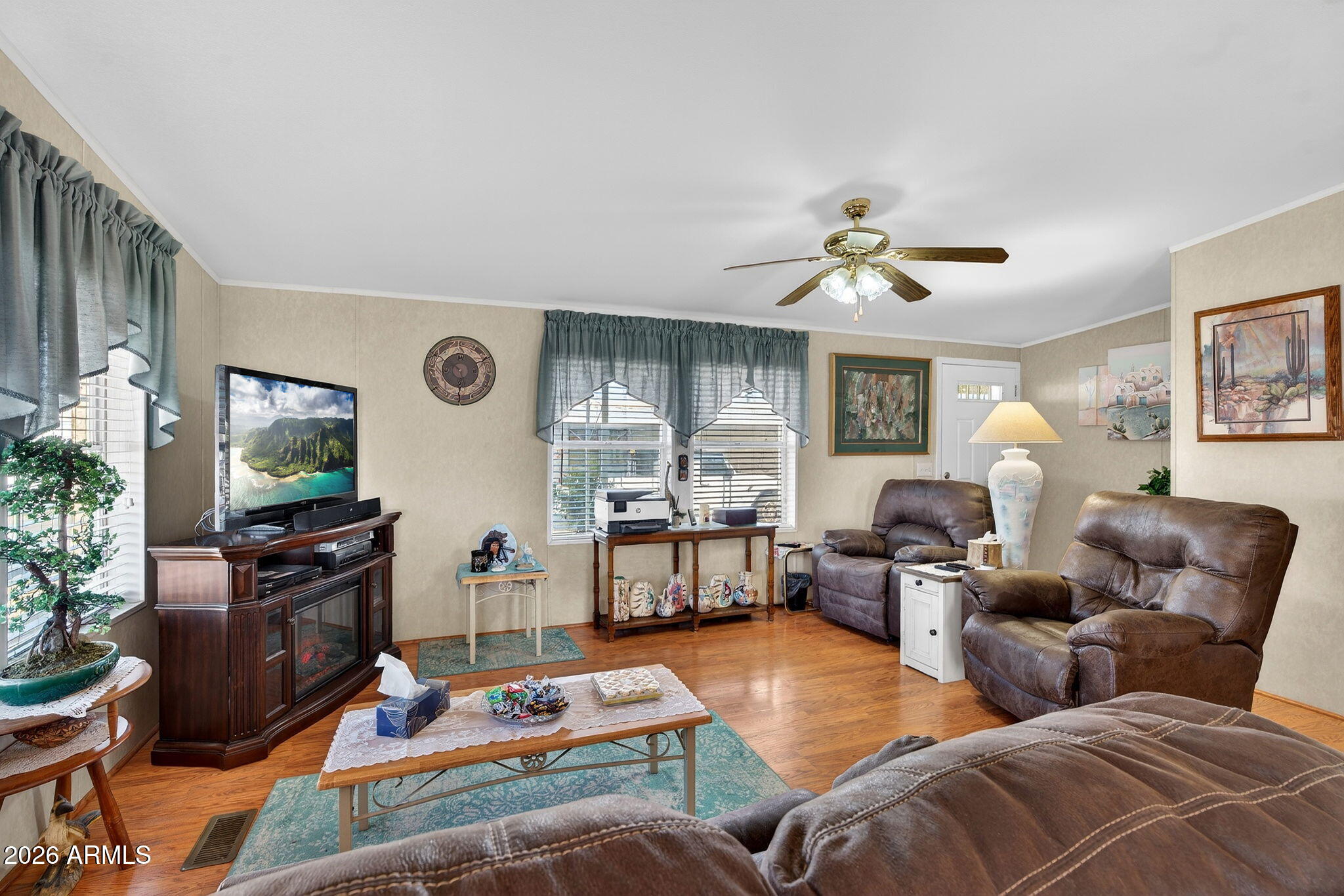 747 East Germann Road, Unit 54 San Tan Valley, AZ 85140 - Photo 2 of 26 a living room with furniture fireplace and flat screen tv