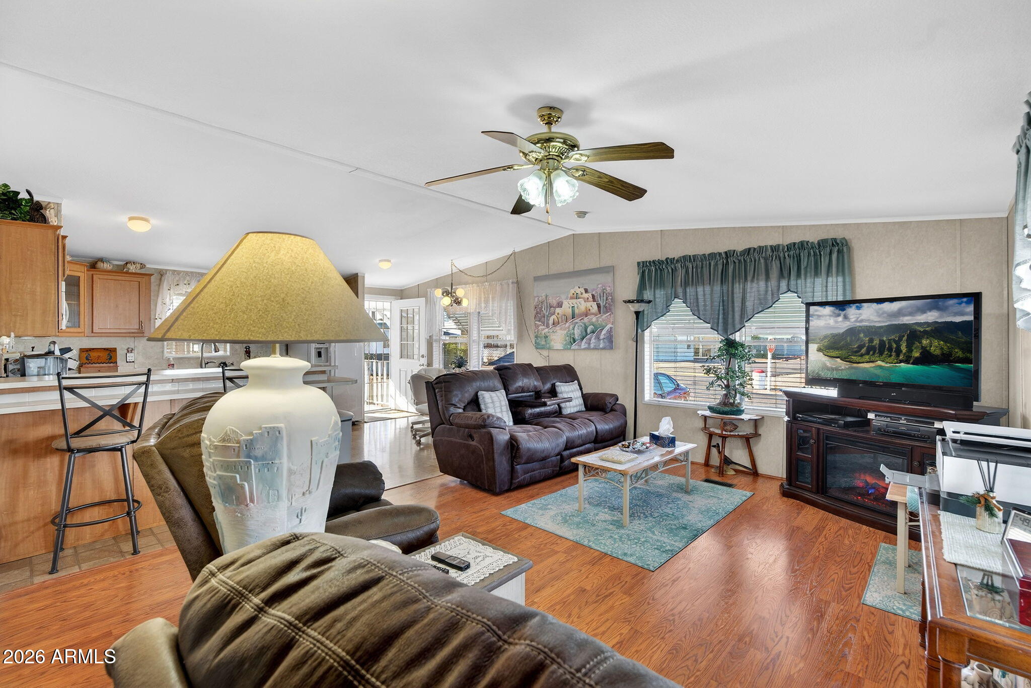747 East Germann Road, Unit 54 San Tan Valley, AZ 85140 - Photo 3 of 26 a living room with furniture and a flat screen tv