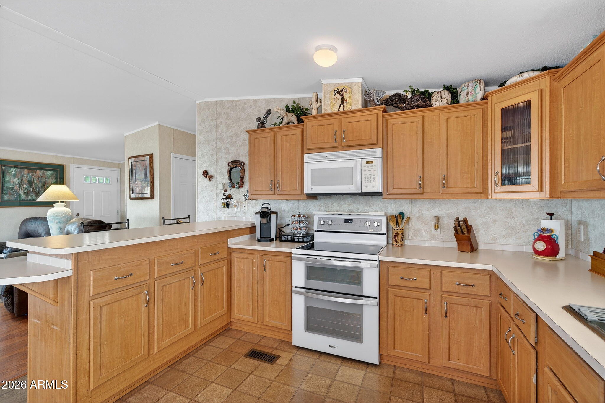 747 East Germann Road, Unit 54 San Tan Valley, AZ 85140 - Photo 7 of 26 a kitchen with stainless steel appliances granite countertop a sink and cabinets