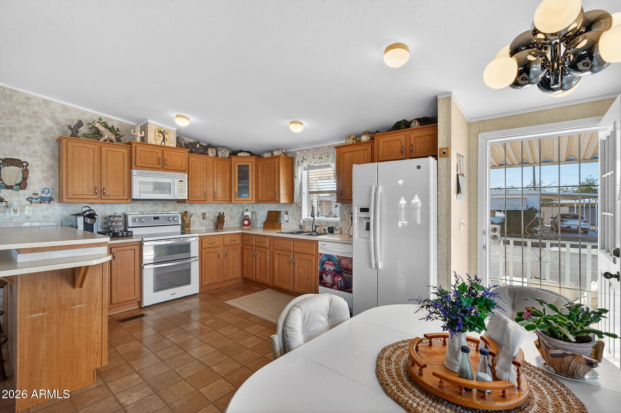 747 East Germann Road, Unit 54 San Tan Valley, AZ 85140 - Photo 8 of 26 a kitchen with stainless steel appliances granite countertop a refrigerator and a sink