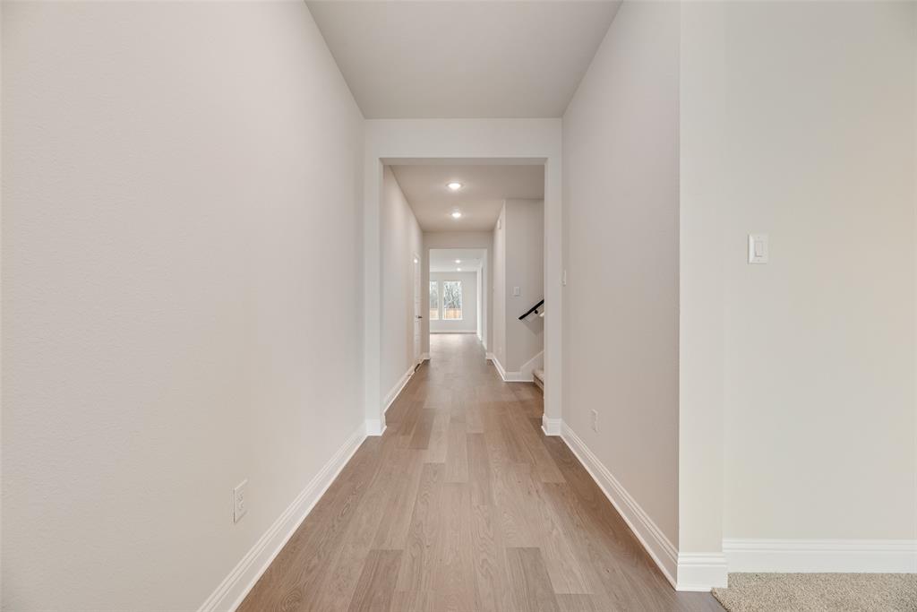 632 Marcus Lane Crowley, TX 76036 - Photo 16 of 34 a view of a hallway with wooden floor