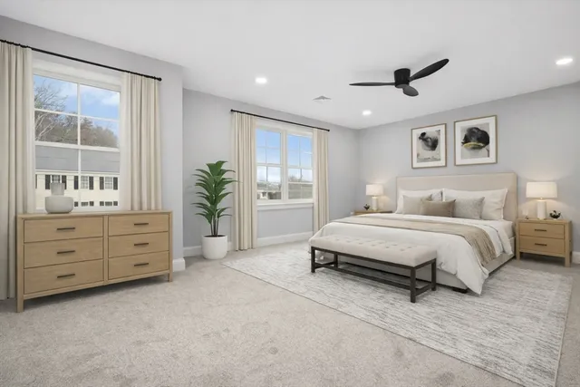 a spacious bedroom with a large bed and a window