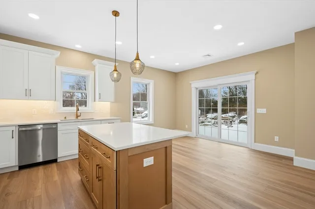 a kitchen with a stove a sink and a refrigerator