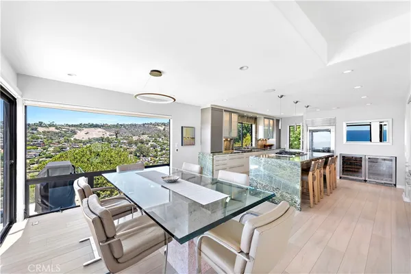 a open kitchen with stainless steel appliances granite countertop a sink stove and wooden cabinets