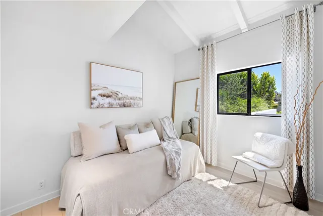a bathroom with a sink a mirror and shower