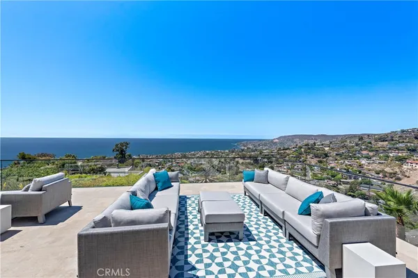 a view of a patio with couches table and chairs
