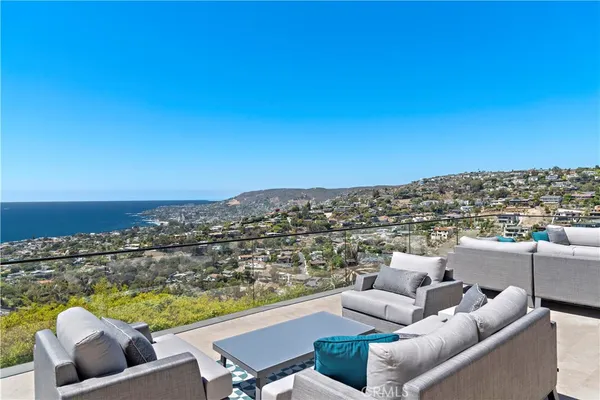 an outdoor living room with furniture