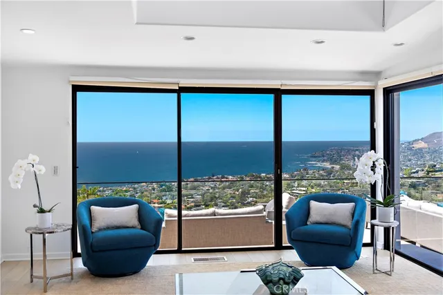 a very nice looking living room with a large window and furniture