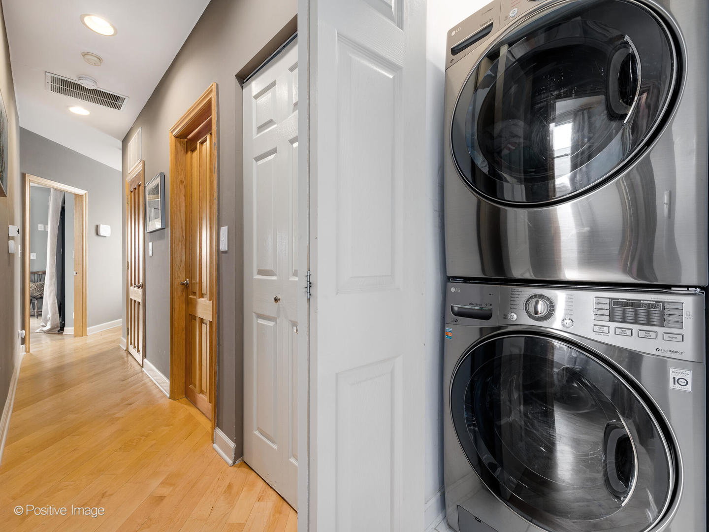 2039 West Rice Street, Unit 3 Chicago, IL 60622 - Photo 13 of 18 a view of a hallway with washer and dryer