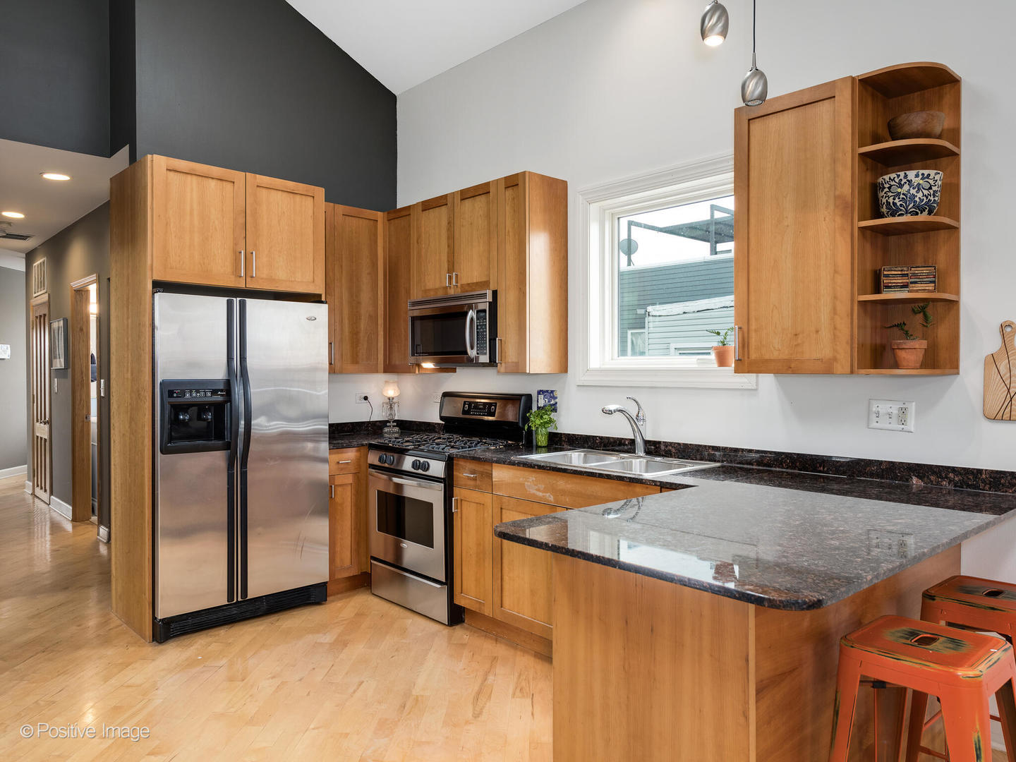 2039 West Rice Street, Unit 3 Chicago, IL 60622 - Photo 7 of 18 a kitchen with stainless steel appliances granite countertop a sink a stove and a refrigerator