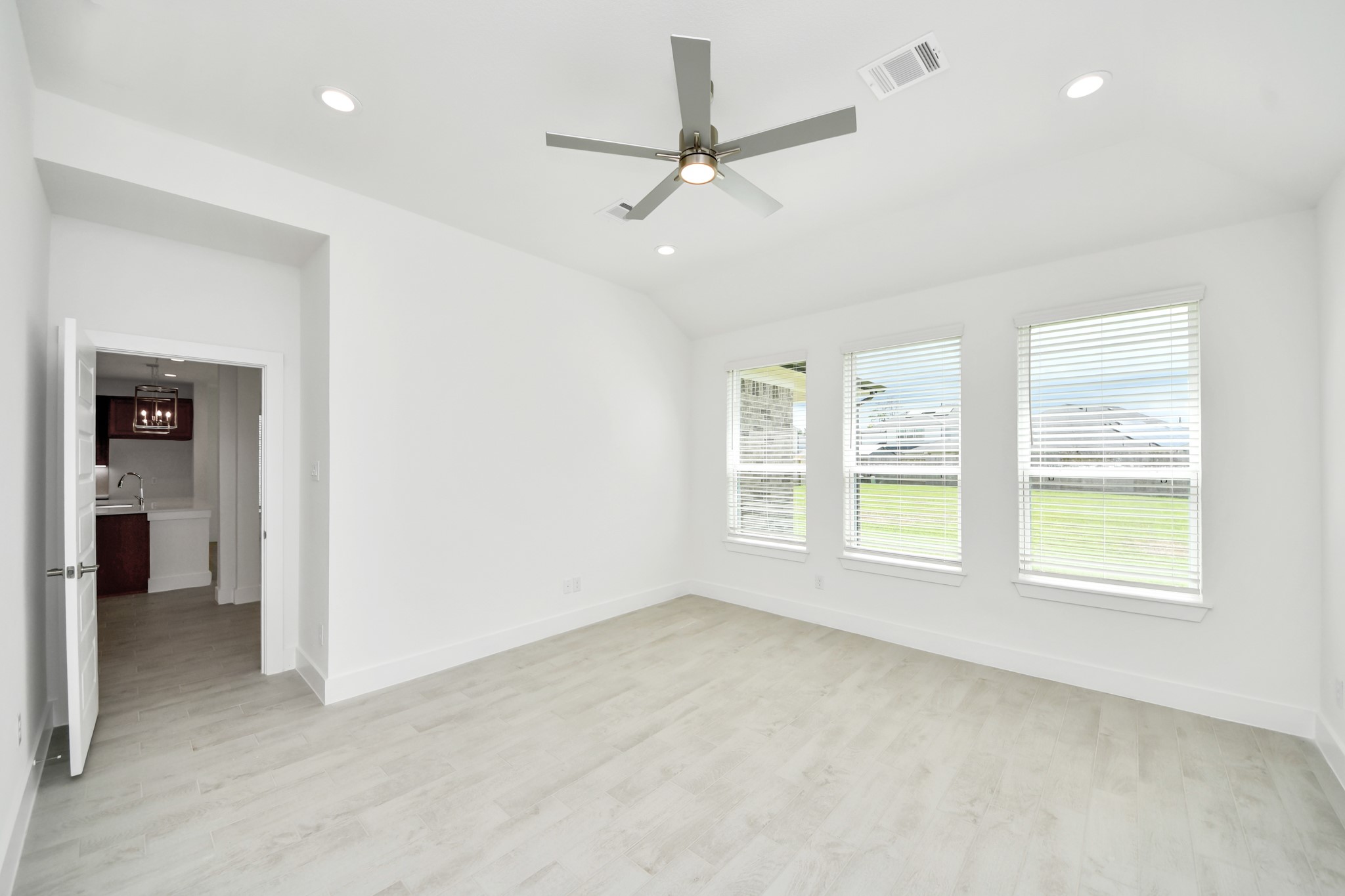 3102 Native Spg Drive Spring, TX 77373 - Photo 22 of 47 Escape and relax in the exquisite primary suite, a haven to unwind after a long day. The spacious room, located on first floor, soothing paint tones, high ceilings, and expansive windows adorned with privacy blinds.