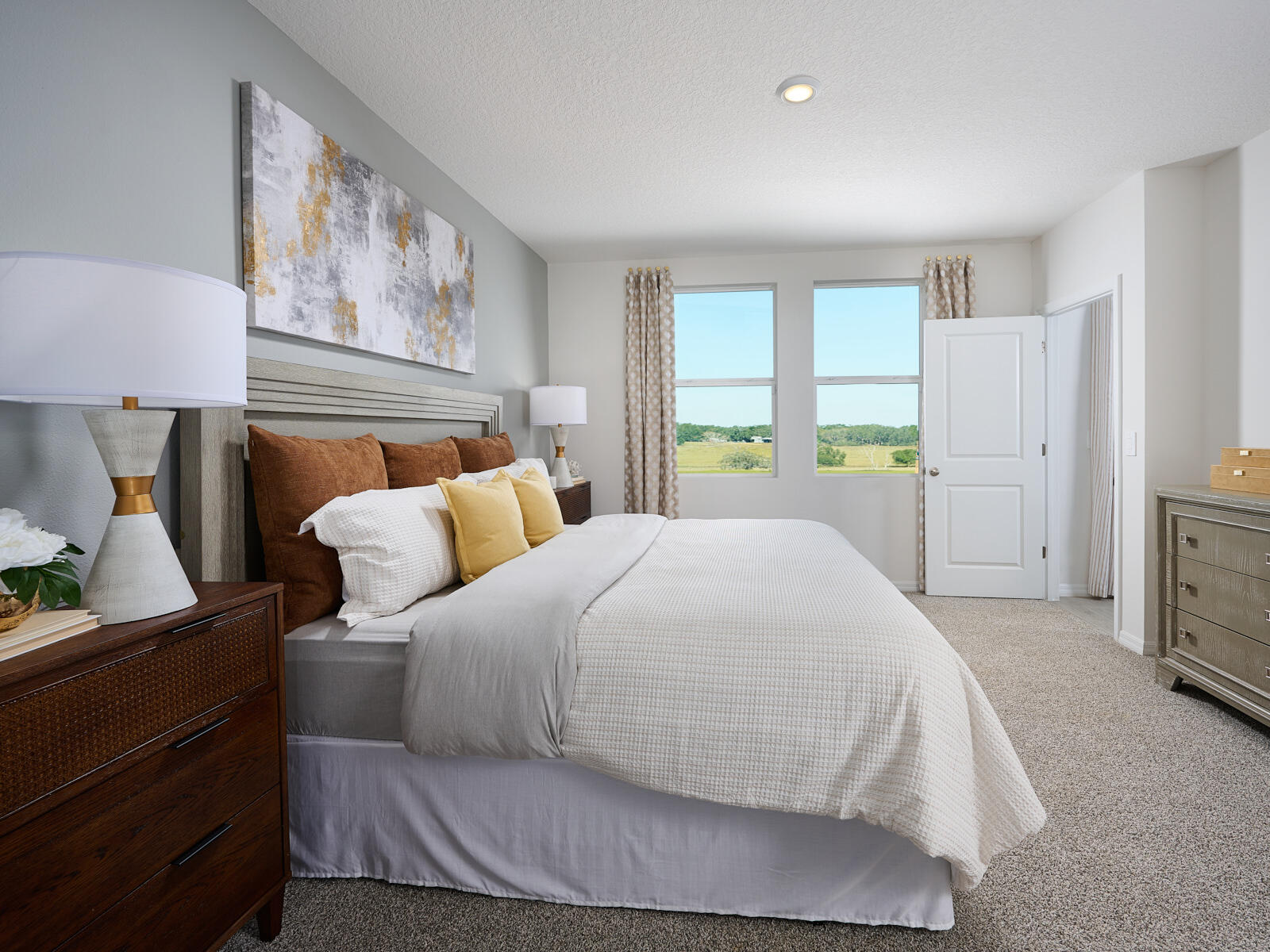 14320 Southwest New Dawn Road Indiantown, FL 34956 - Photo 7 of 9 a spacious bedroom with a bed and a window