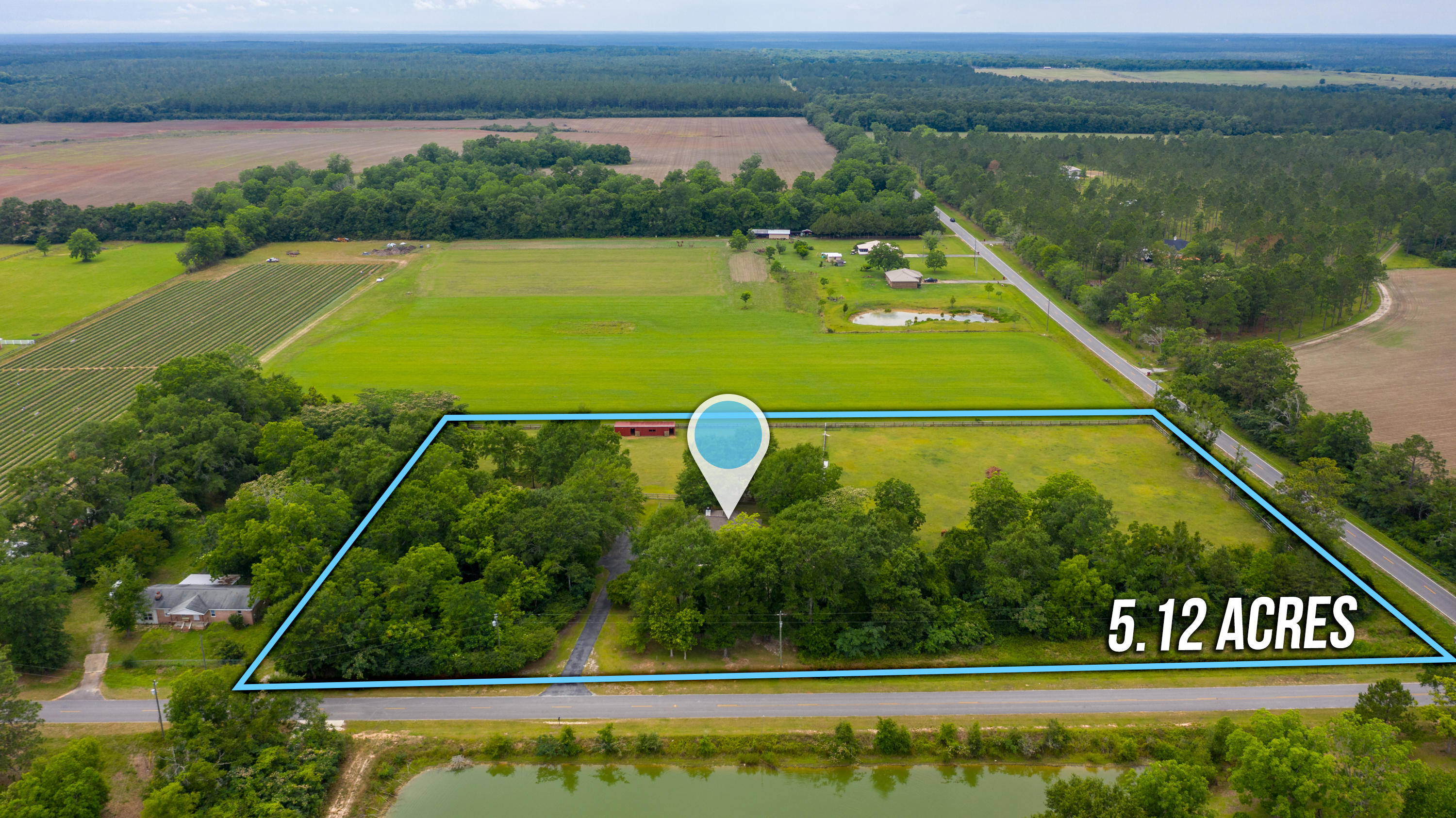 5780 Griffith Mill Road Baker, FL 32531 - Photo 2 of 50 a view of a tennis court with a lake view