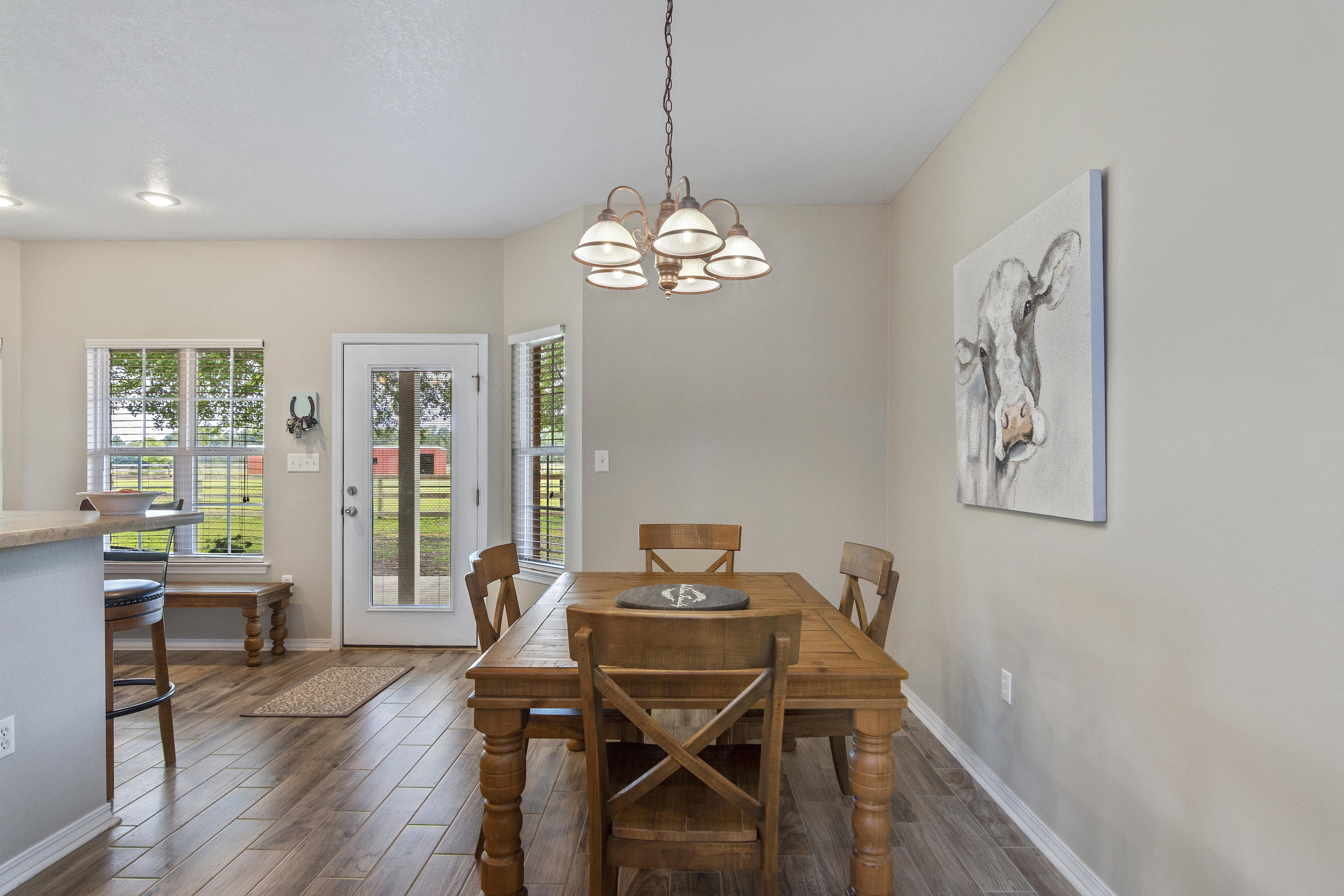 5780 Griffith Mill Road Baker, FL 32531 - Photo 11 of 50 a view of a dining room with furniture window and wooden floor