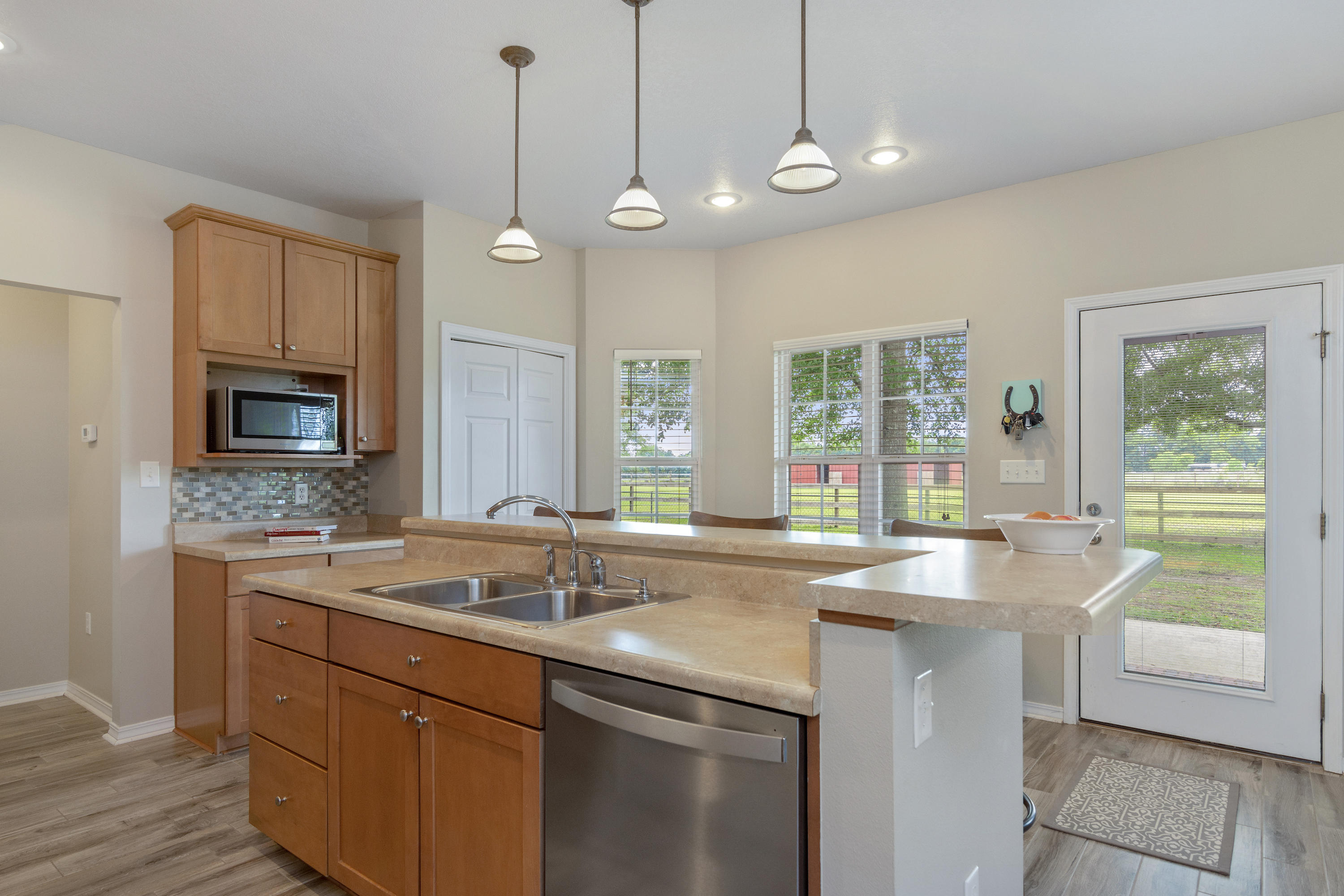 5780 Griffith Mill Road Baker, FL 32531 - Photo 13 of 50 a kitchen with a sink stove and microwave