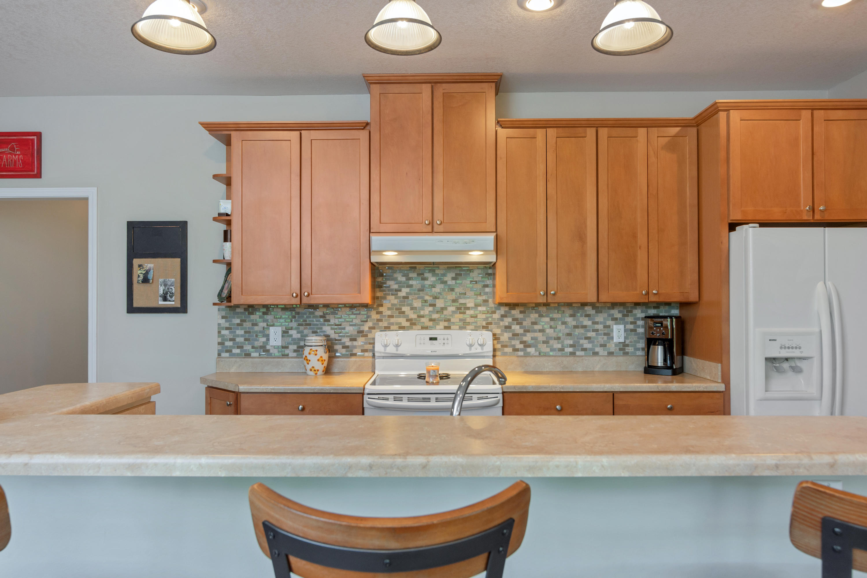 5780 Griffith Mill Road Baker, FL 32531 - Photo 15 of 50 a kitchen with granite countertop a sink a stove and a microwave