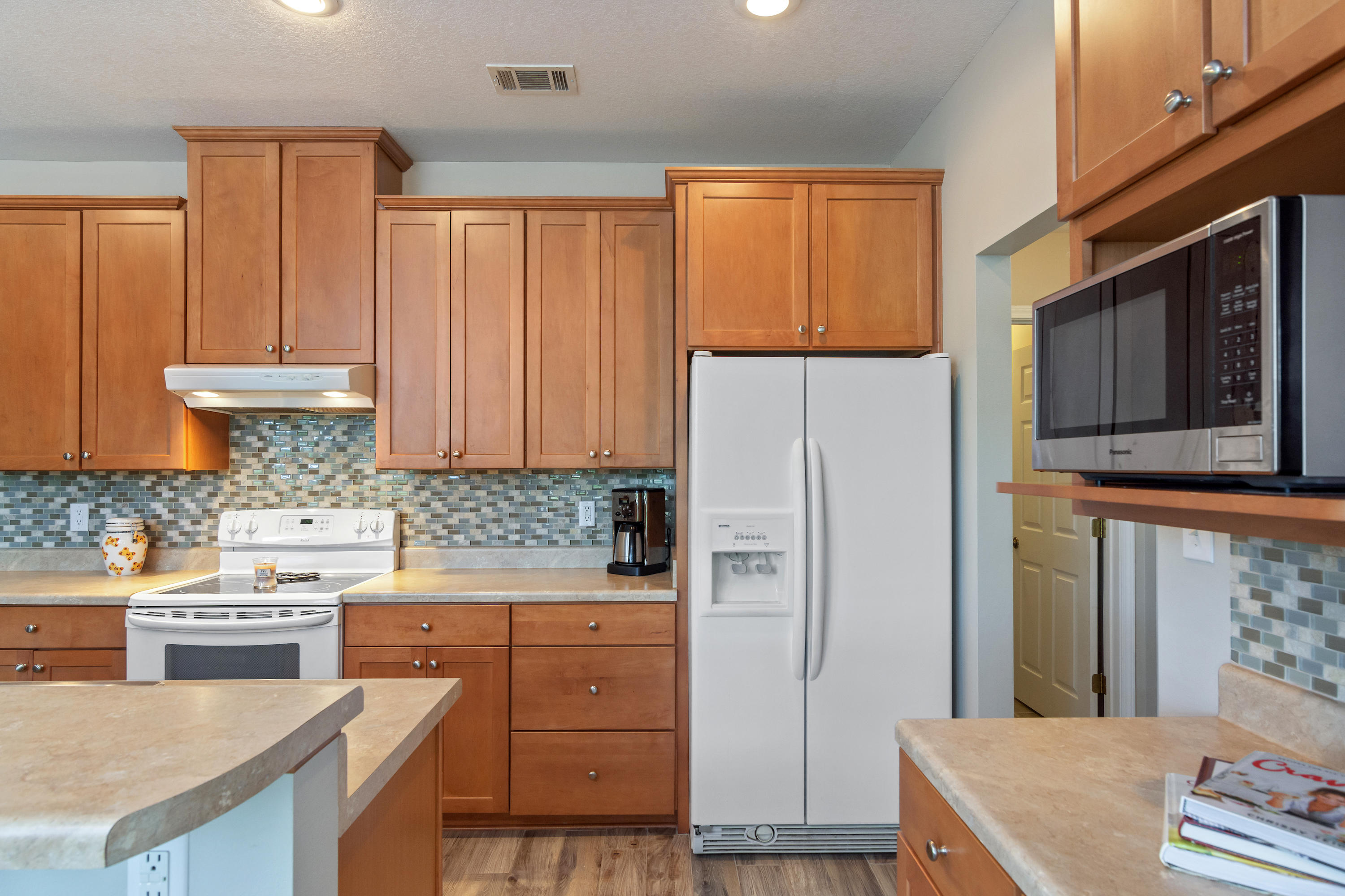 5780 Griffith Mill Road Baker, FL 32531 - Photo 16 of 50 a kitchen with a stove a refrigerator and a stove