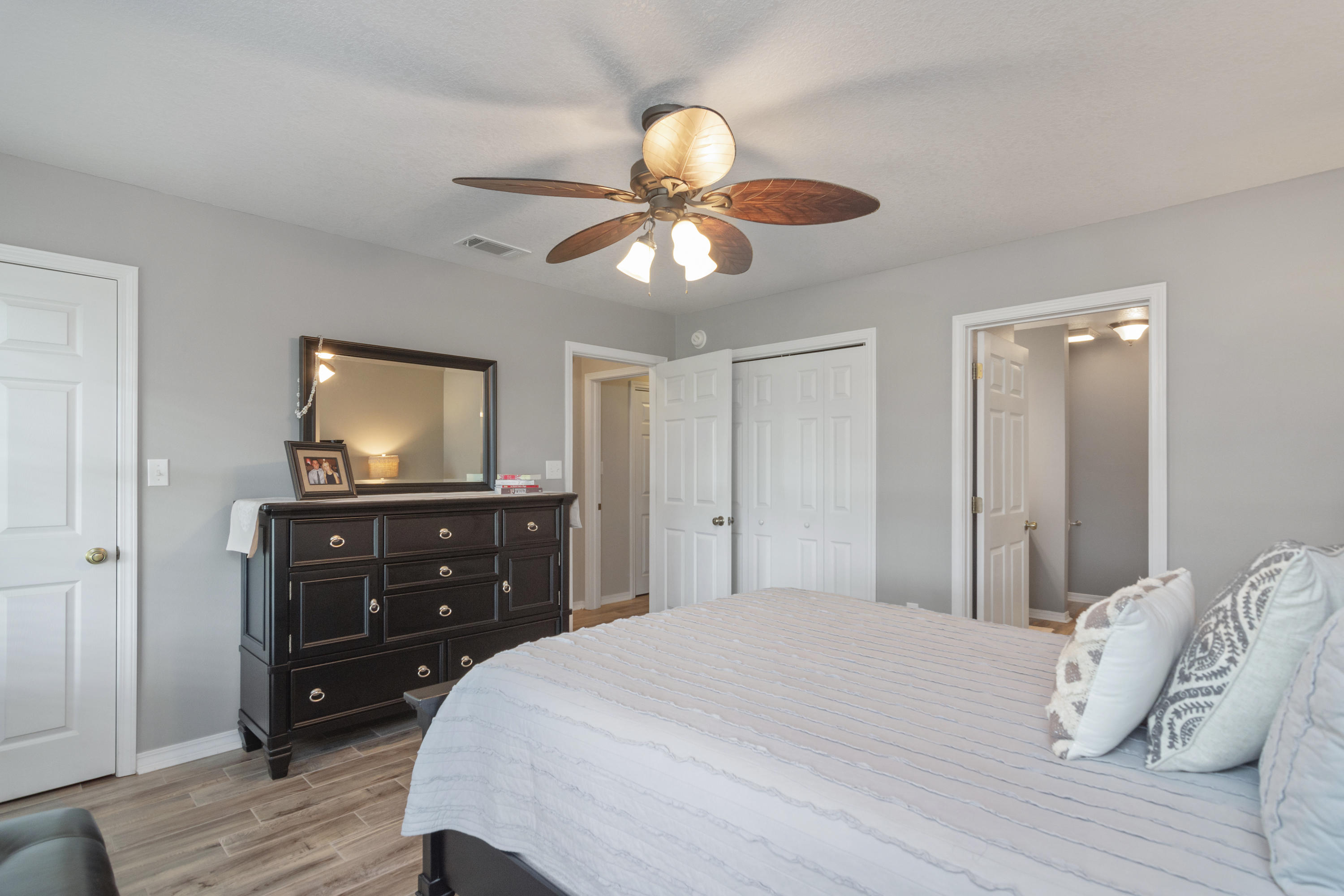 5780 Griffith Mill Road Baker, FL 32531 - Photo 19 of 50 a bedroom with a bed and a dresser