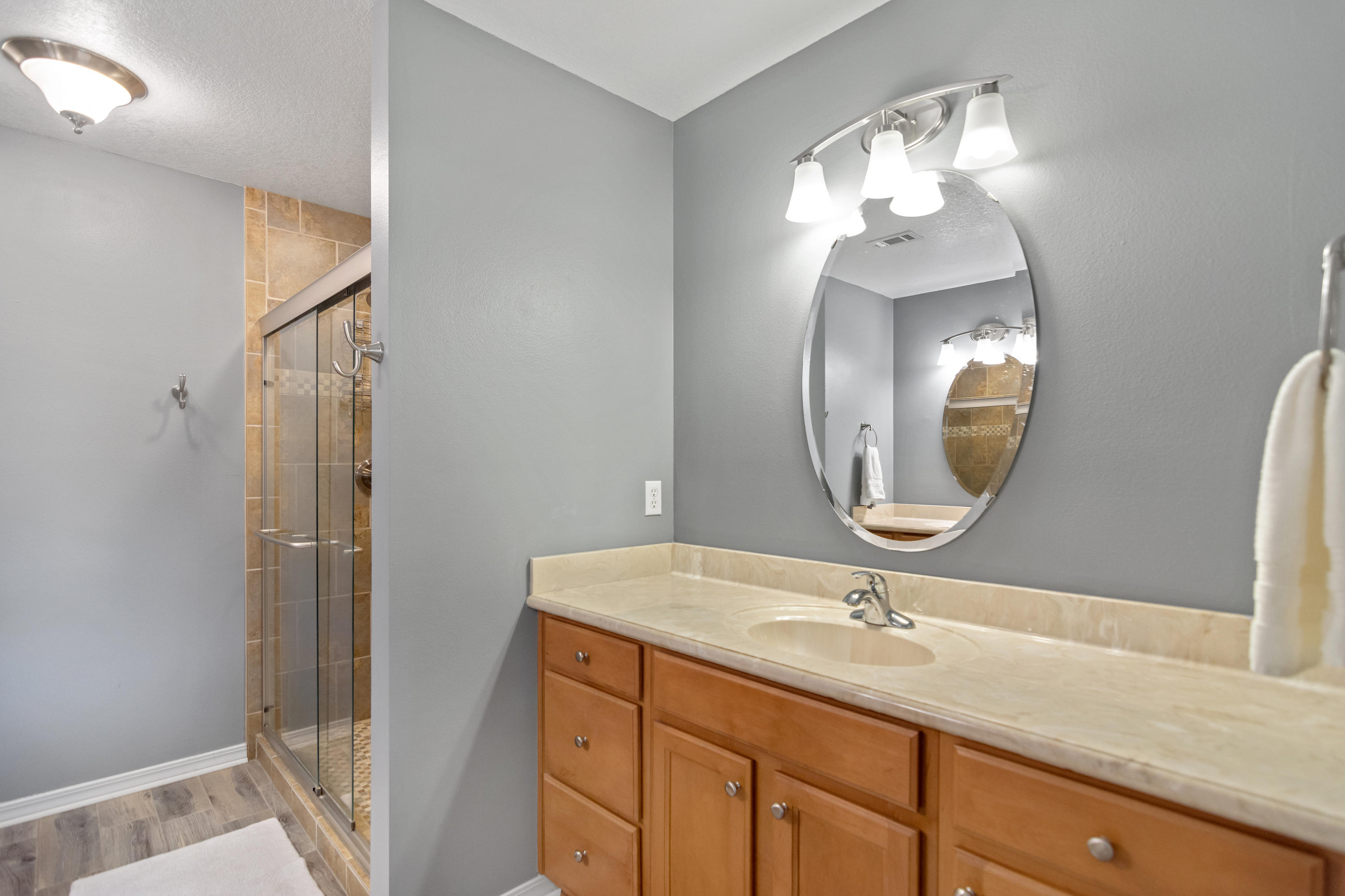 5780 Griffith Mill Road Baker, FL 32531 - Photo 20 of 50 a bathroom with a double vanity sink and a mirror