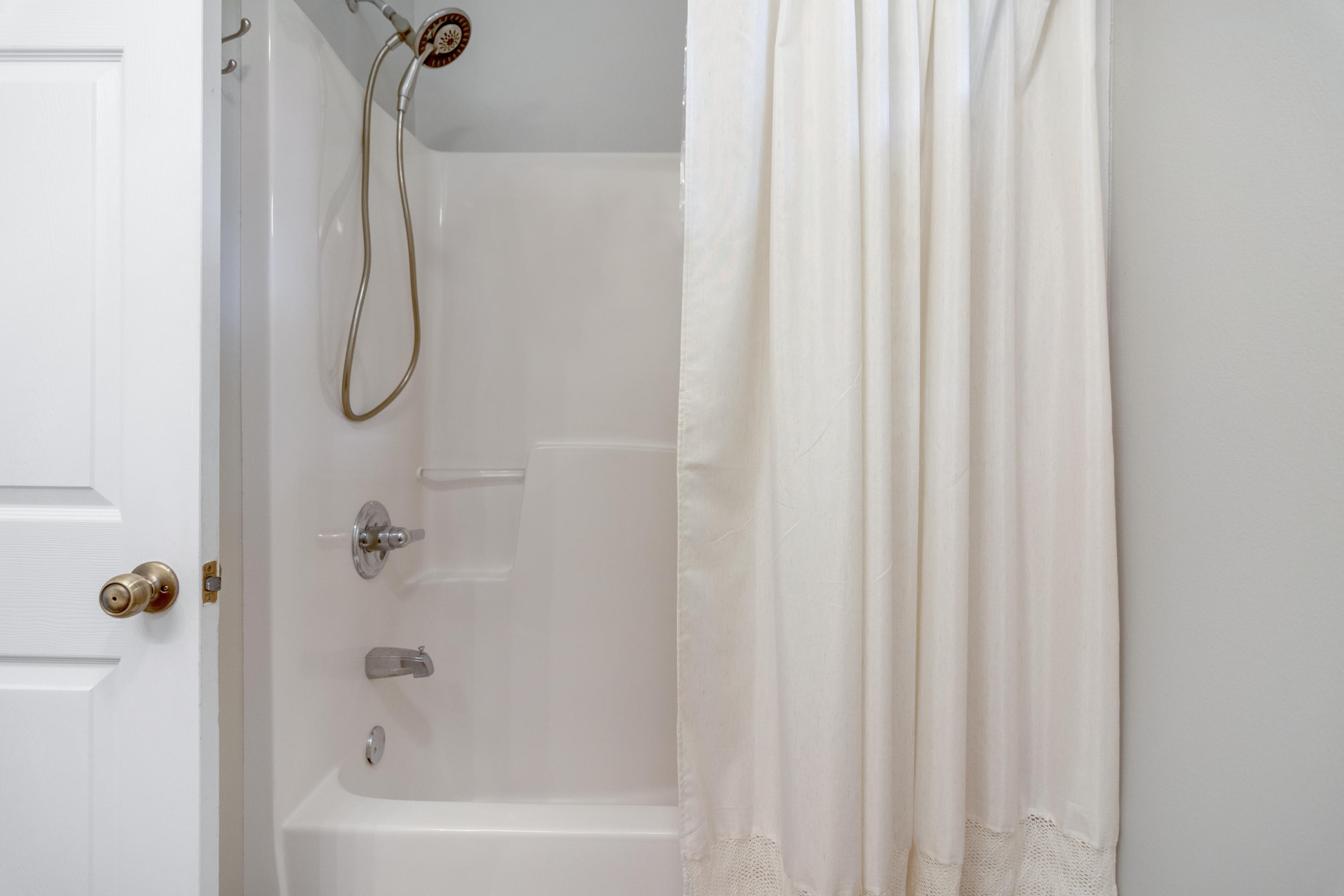 5780 Griffith Mill Road Baker, FL 32531 - Photo 29 of 50 a bathroom with a shower and a bath tub