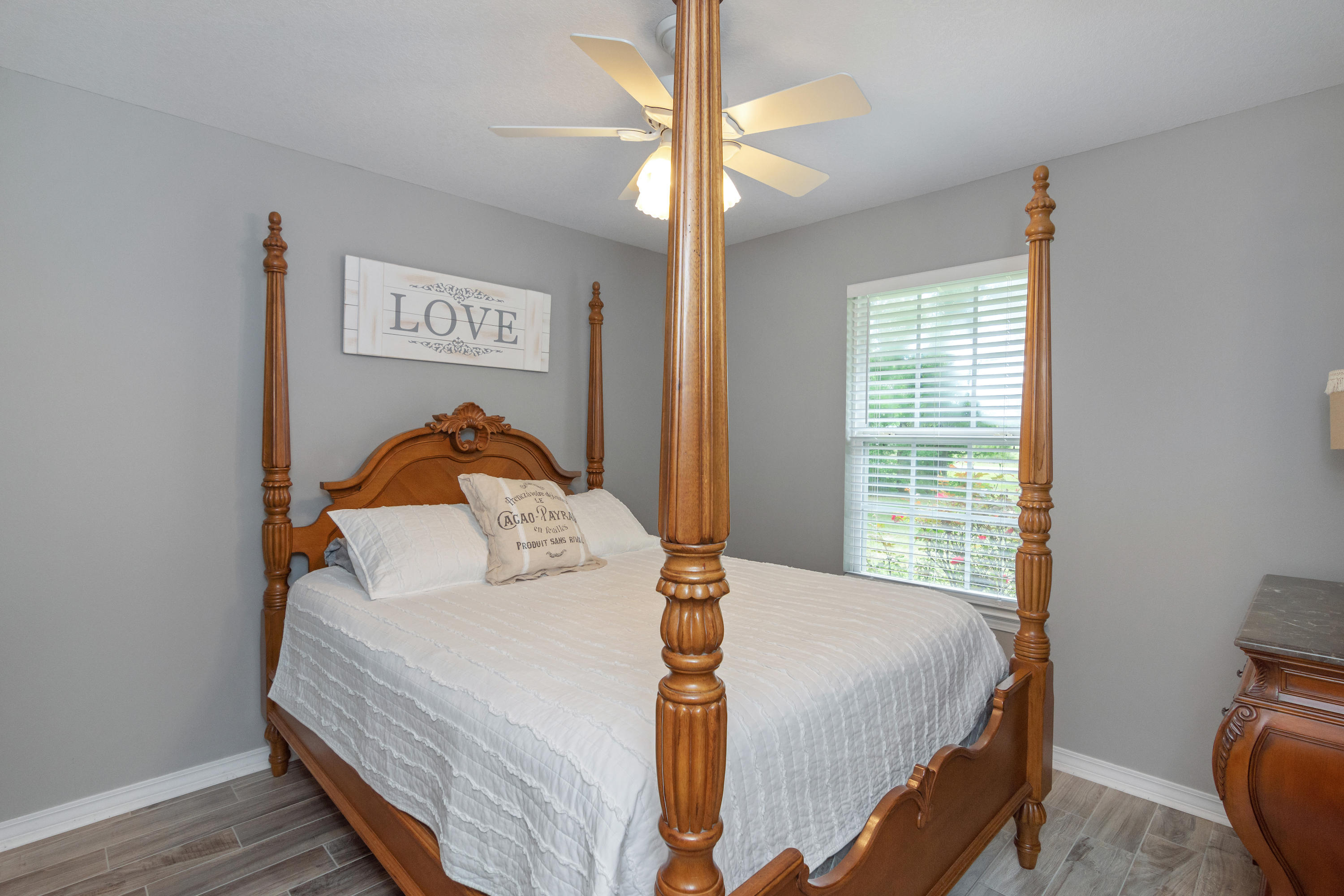 5780 Griffith Mill Road Baker, FL 32531 - Photo 30 of 50 a bedroom with a bed and a night stand