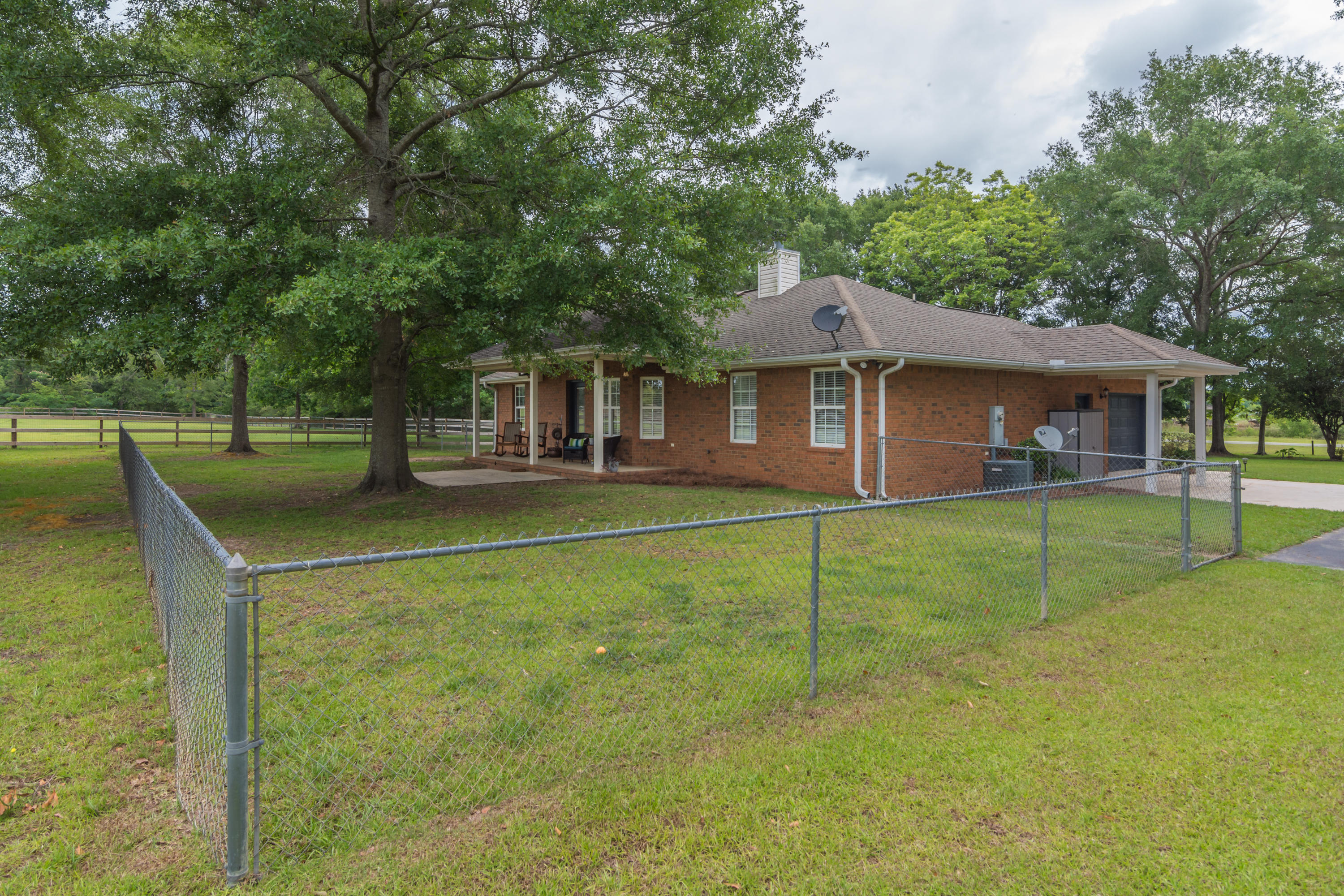 5780 Griffith Mill Road Baker, FL 32531 - Photo 37 of 50 a view of a house with a backyard