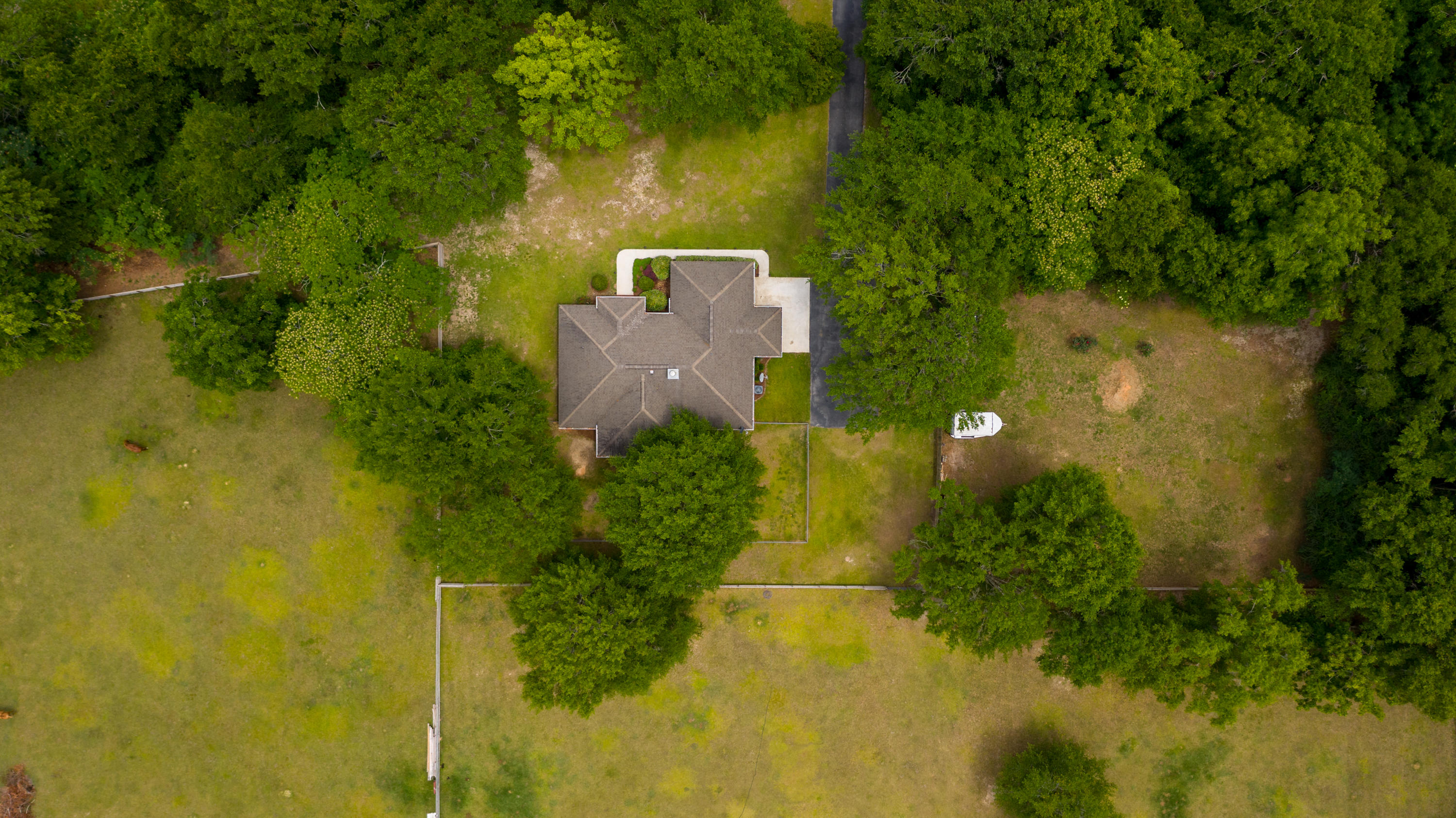 5780 Griffith Mill Road Baker, FL 32531 - Photo 47 of 50 an aerial view of a house with a yard