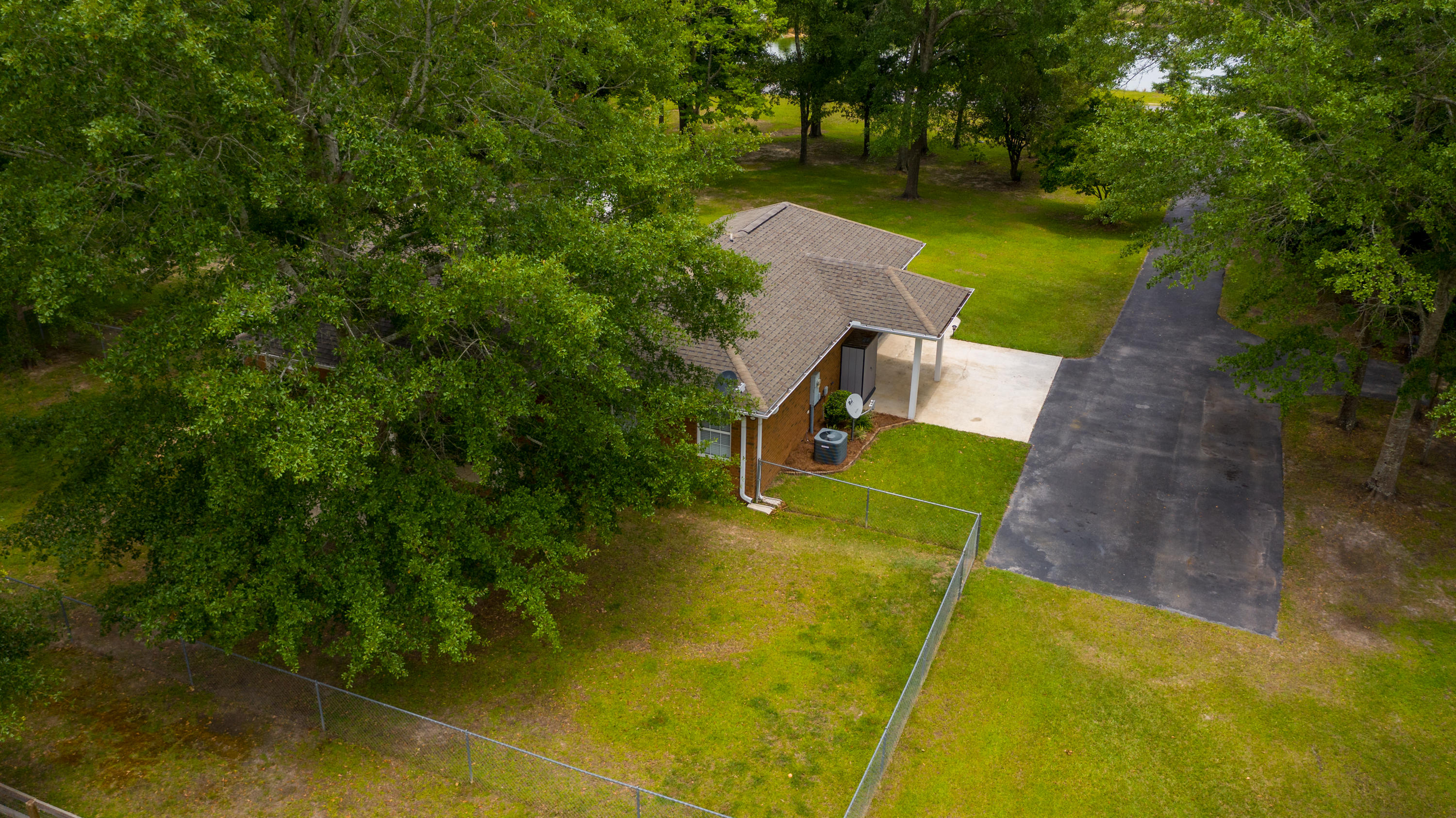 5780 Griffith Mill Road Baker, FL 32531 - Photo 49 of 50 an aerial view of a house with swimming pool