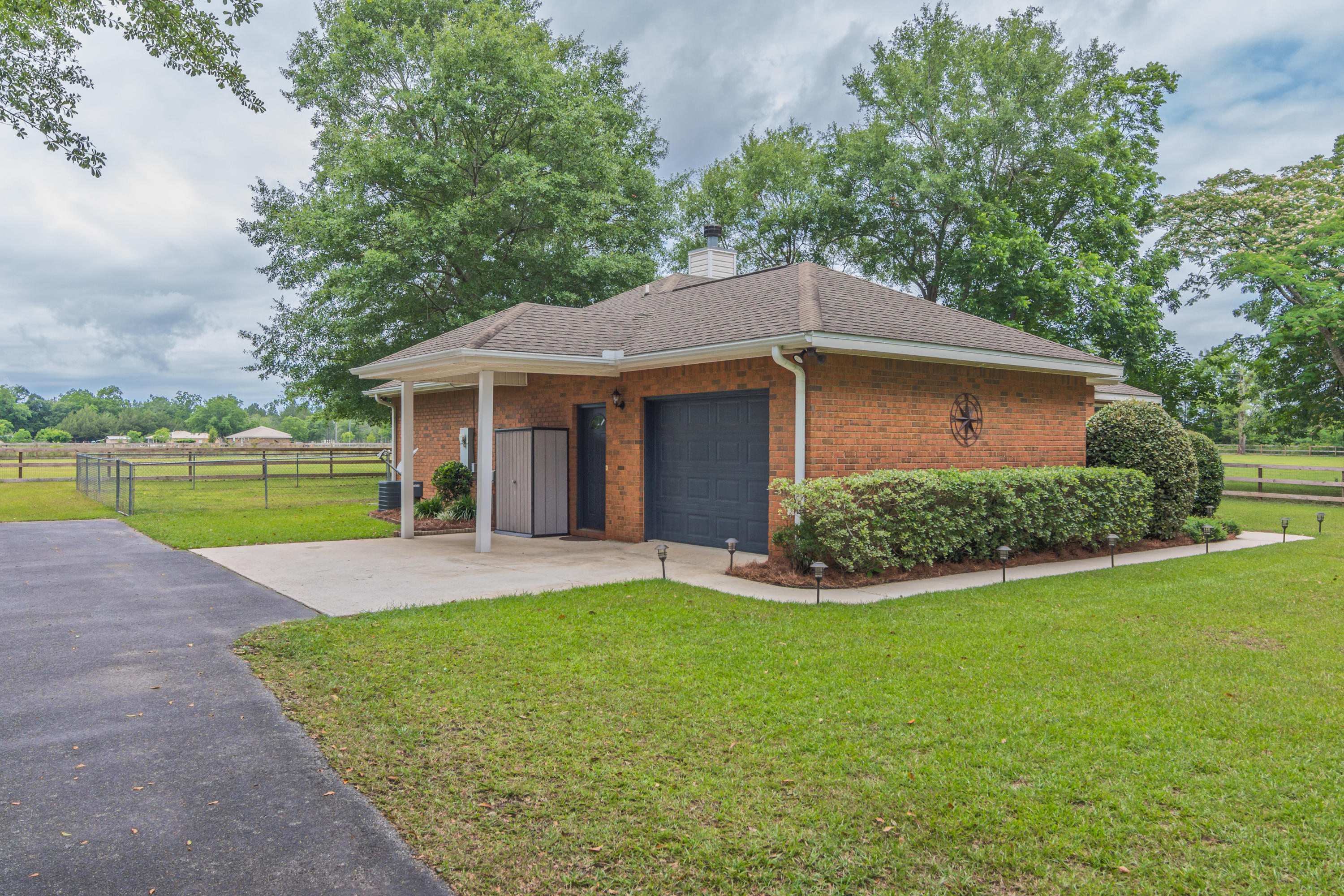 5780 Griffith Mill Road Baker, FL 32531 - Photo 6 of 50 a view of a house with a yard and sitting area