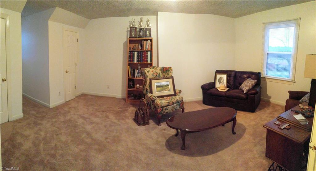 6251 Phillippi Road Julian, NC 27283 - Photo 16 of 30 Bedroom upstairs with lots of room and beautiful views outside!
