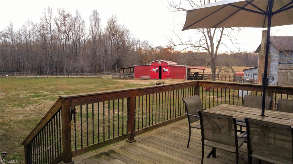 6251 Phillippi Road Julian, NC 27283 - Photo 24 of 30 Views from the deck! Beautiful 6 stall barn with a tack room with power and water!