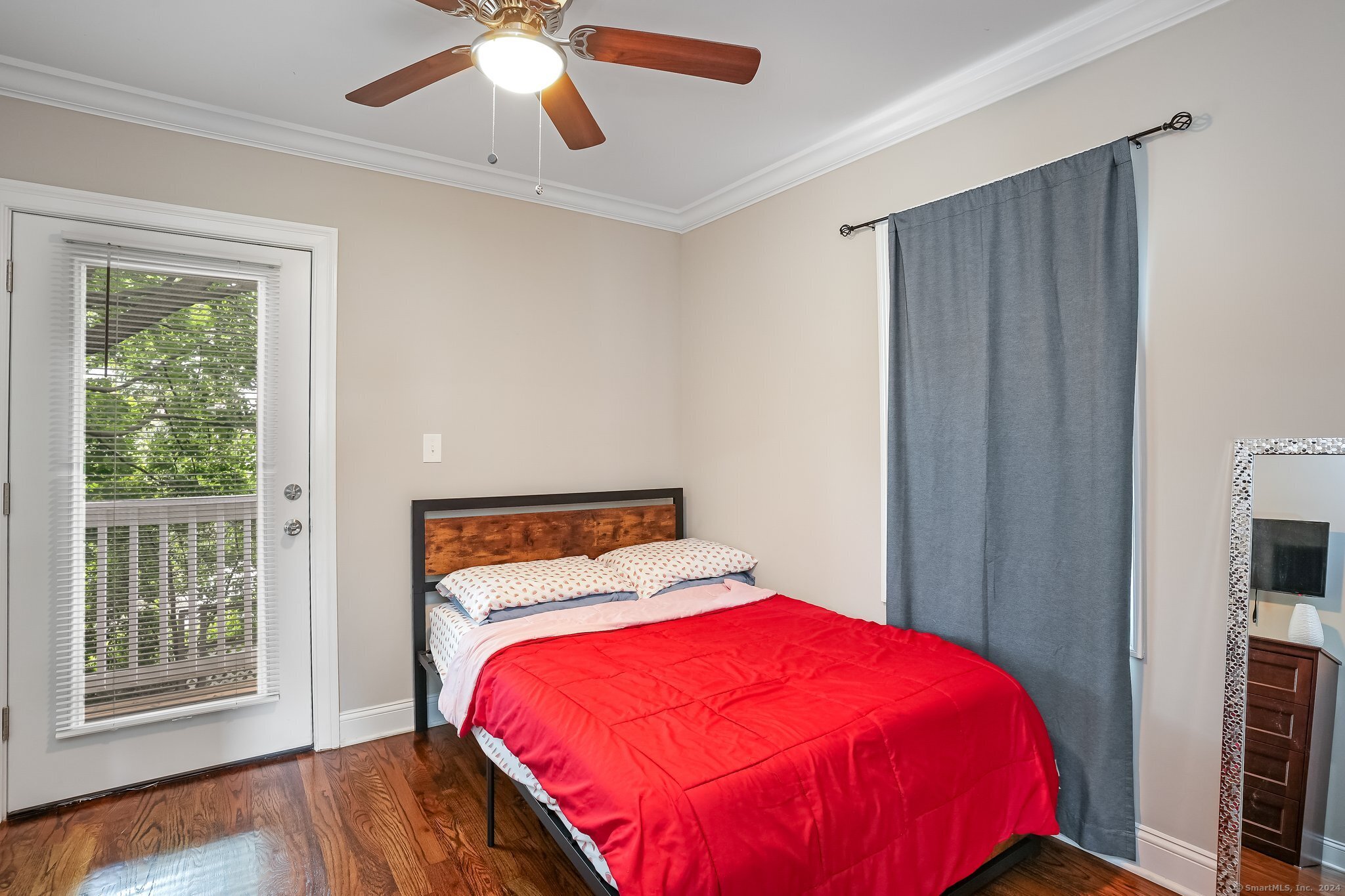 75 Hemlock Street Bridgeport, CT 06605 - Photo 15 of 24 a bedroom with a bed and a window