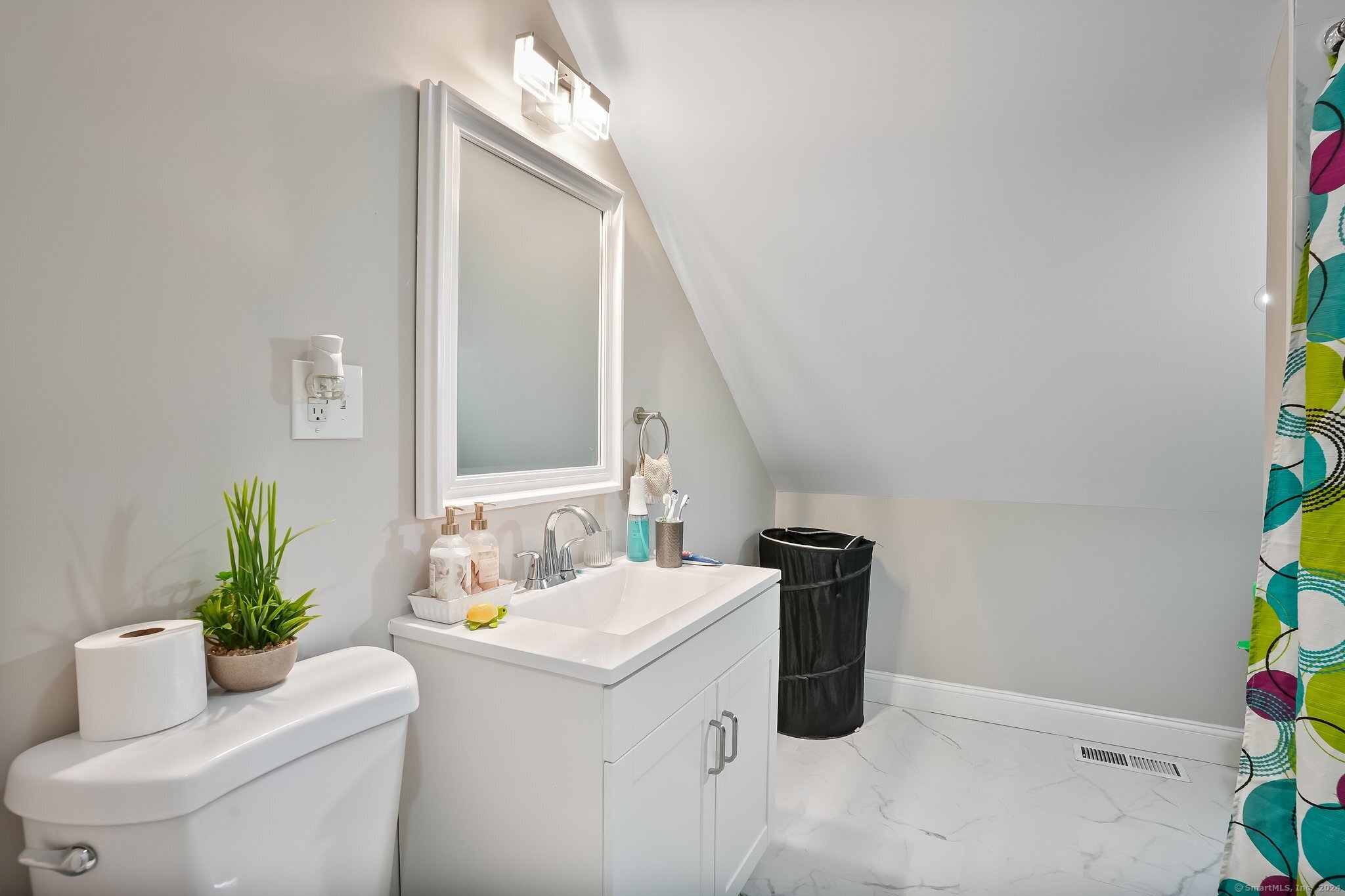 75 Hemlock Street Bridgeport, CT 06605 - Photo 19 of 24 a bathroom with a sink and a mirror