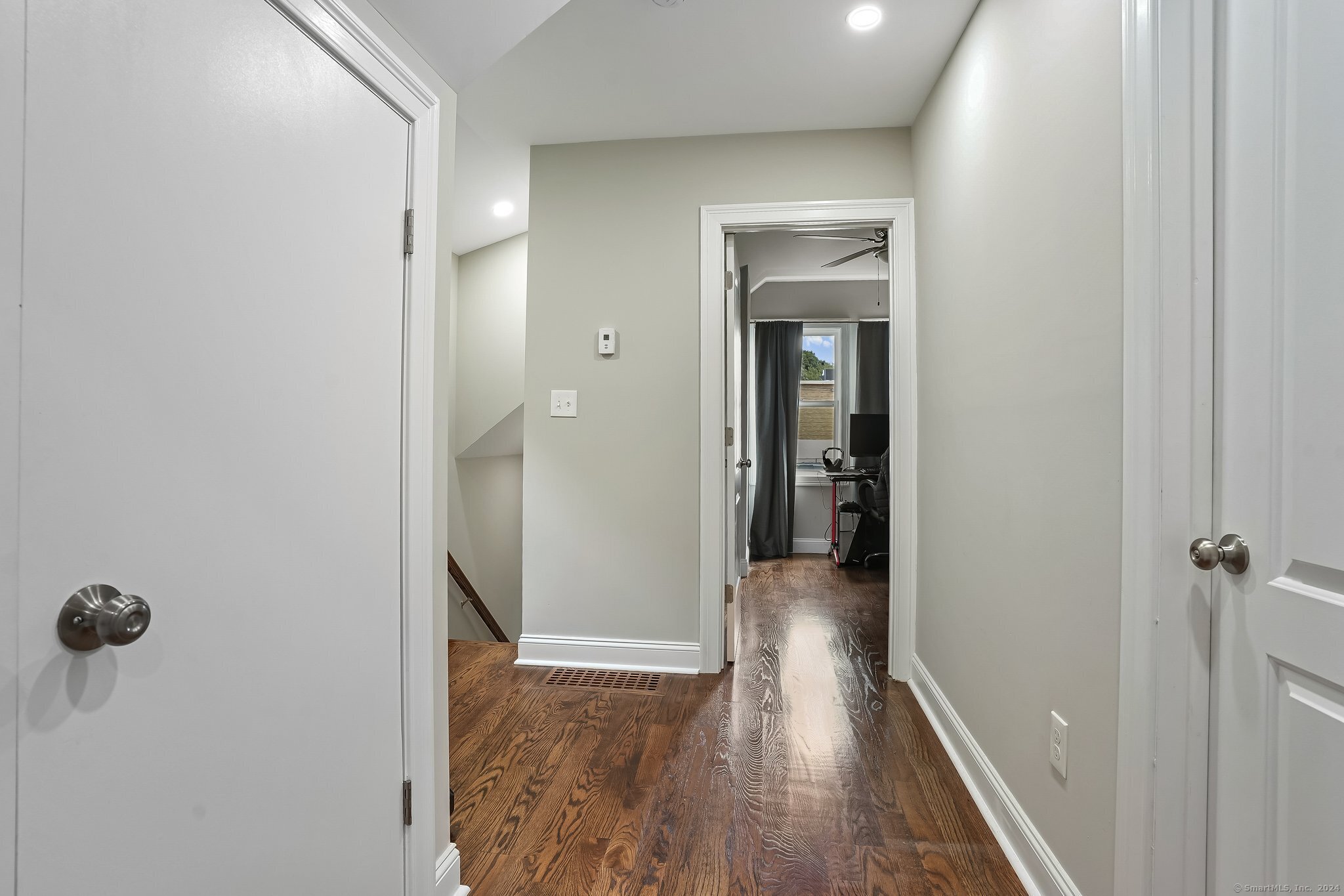 75 Hemlock Street Bridgeport, CT 06605 - Photo 20 of 24 a view of a hallway with wooden floor and closet