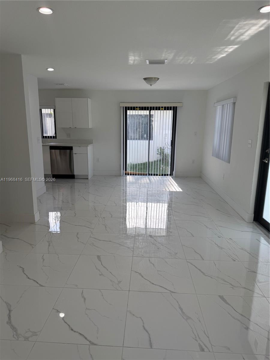 210 Southwest 3rd Street Florida City, FL 33034 - Photo 11 of 15 a view of an empty room with a window
