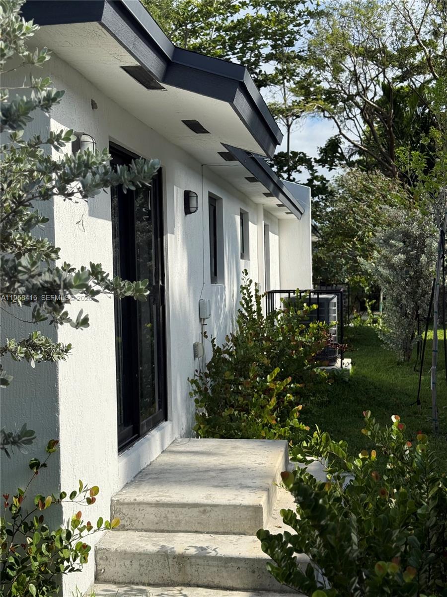 210 Southwest 3rd Street Florida City, FL 33034 - Photo 6 of 15 a front view of a house with a yard