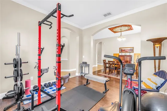 a living room with furniture and next to a window