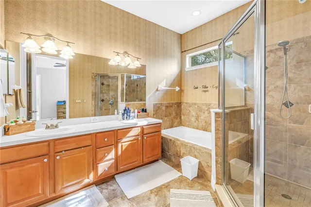 a bathroom with a double vanity sink and a mirror
