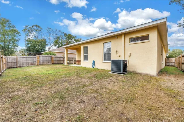 a view of a backyard with a garden and plants