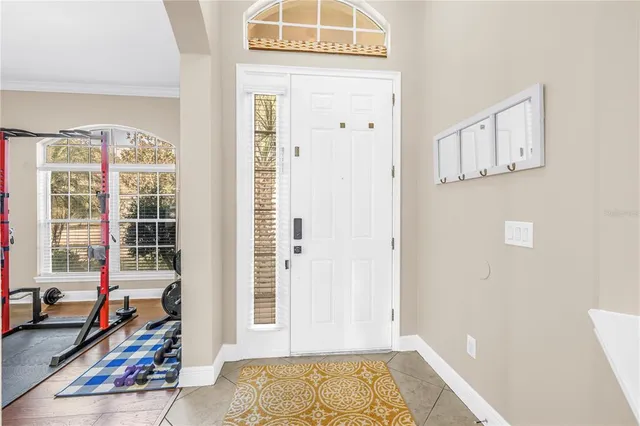 a view of a livingroom with wooden floor and a window