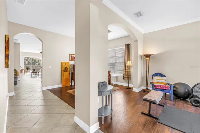 a view of a lobby room with furniture and wooden floor